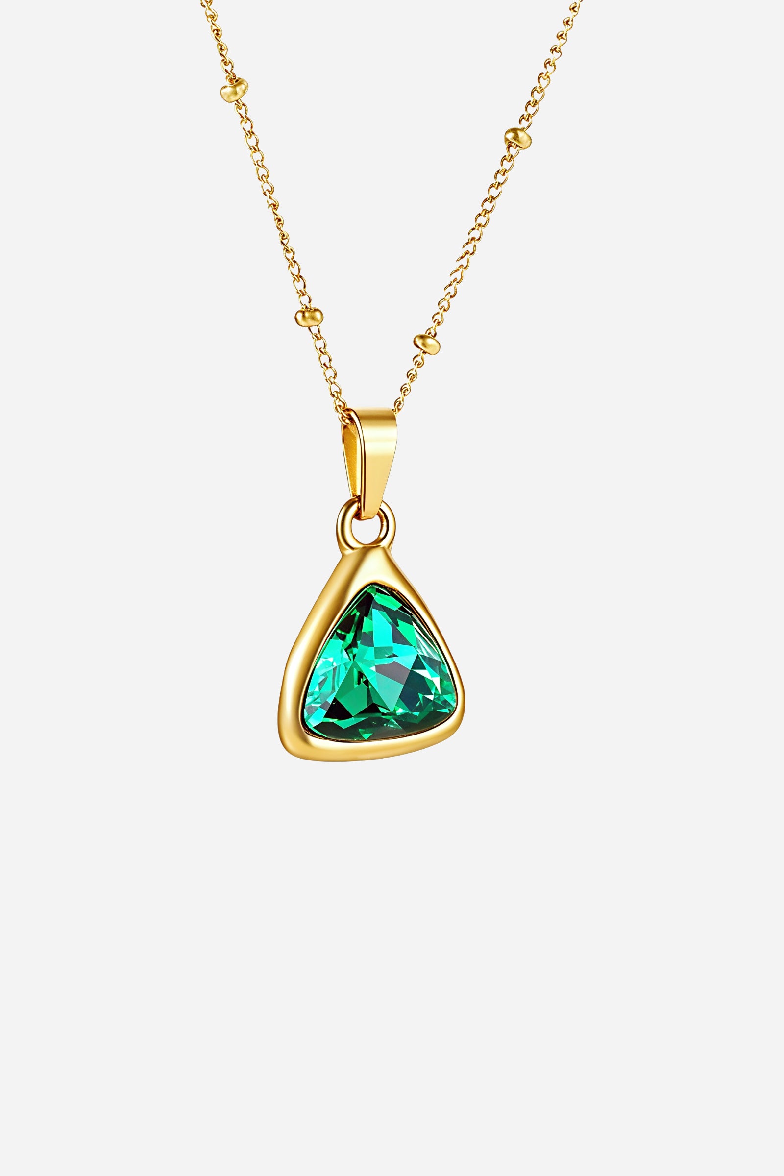 Top-view image of GLISTIA Emerald Radiance Necklace showing the 18K PVD gold plated chain and pendant.