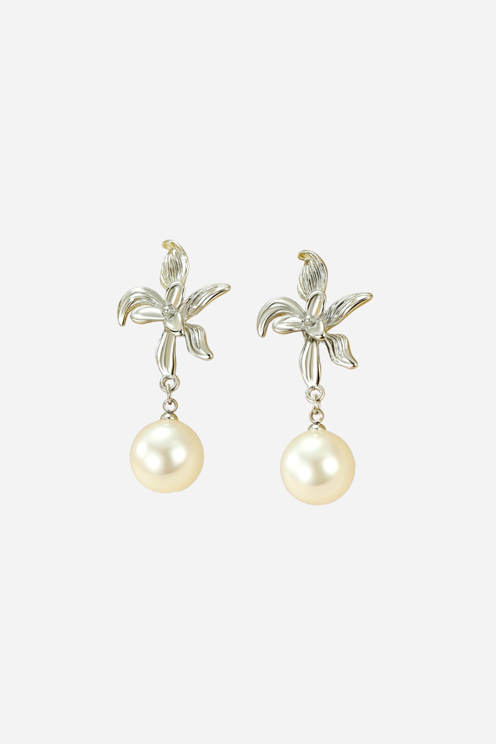 Silver-tone floral pearl drop earrings crafted from stainless steel, featuring a detailed flower motif and a single imitation pearl dangle for an elegant and timeless look – GLISTIA.