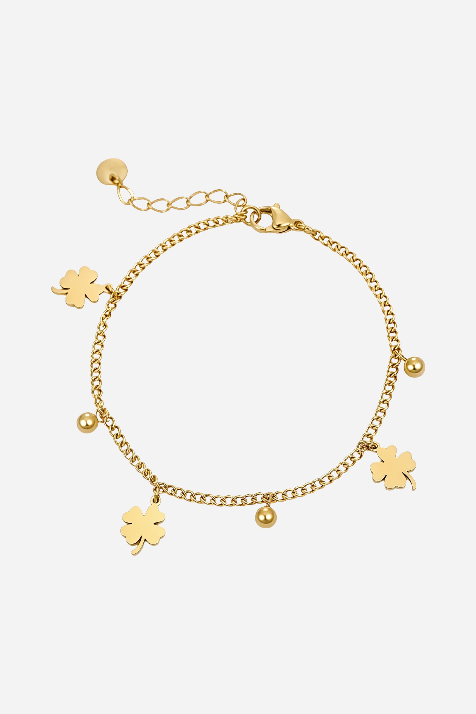 Top-view of GLISTIA’s gold charm bracelet highlighting polished four-leaf clover pendants and round bead accents.
