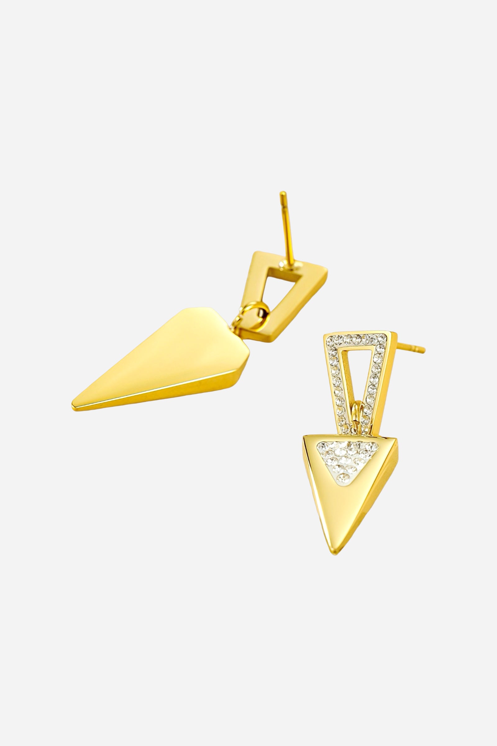 Angled view of geometric crystal triangle drop earrings crafted from stainless steel with a radiant PVD 18K gold plated finish, featuring inverted triangular shapes accented with pavé crystals - GLISTIA.