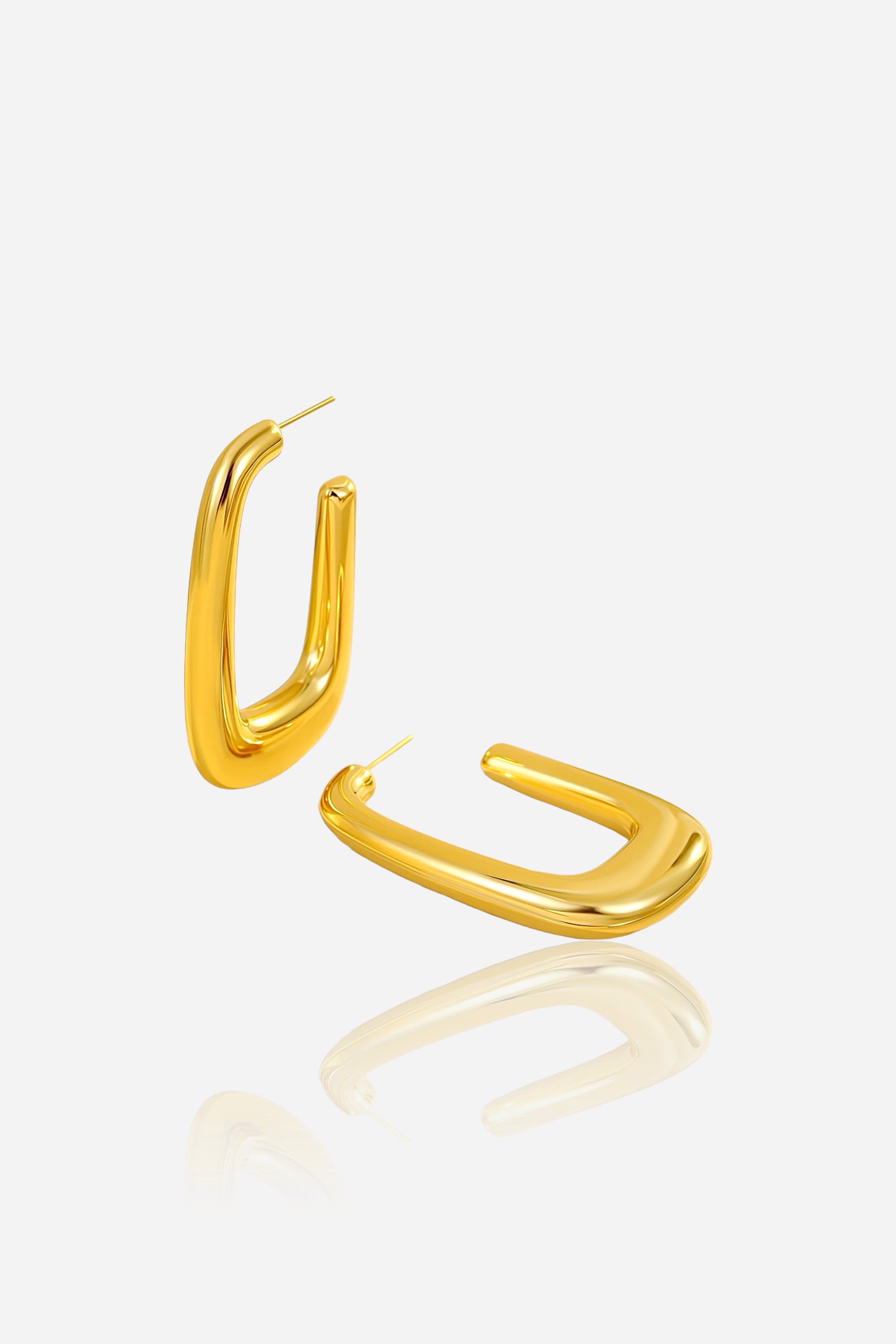 Angled view of geometric rectangular hoop earrings with a modern U-shaped silhouette, crafted from stainless steel and finished in polished PVD 18K gold plating – GLISTIA.
