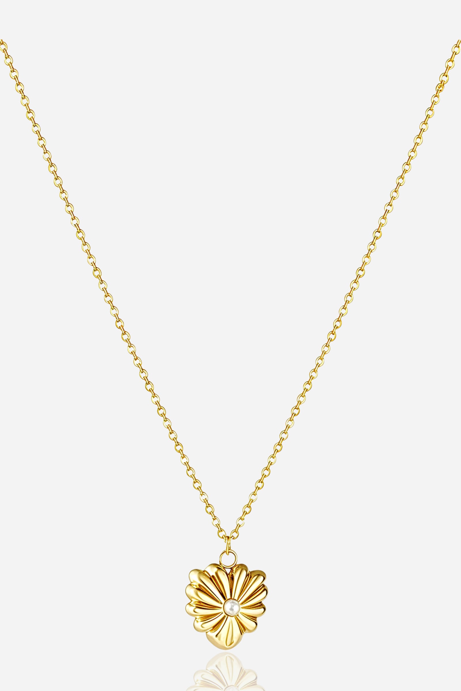 Zoom view of GLISTIA 18K gold plated blossom pendant showcasing the raised petal detailing and pearl accent.