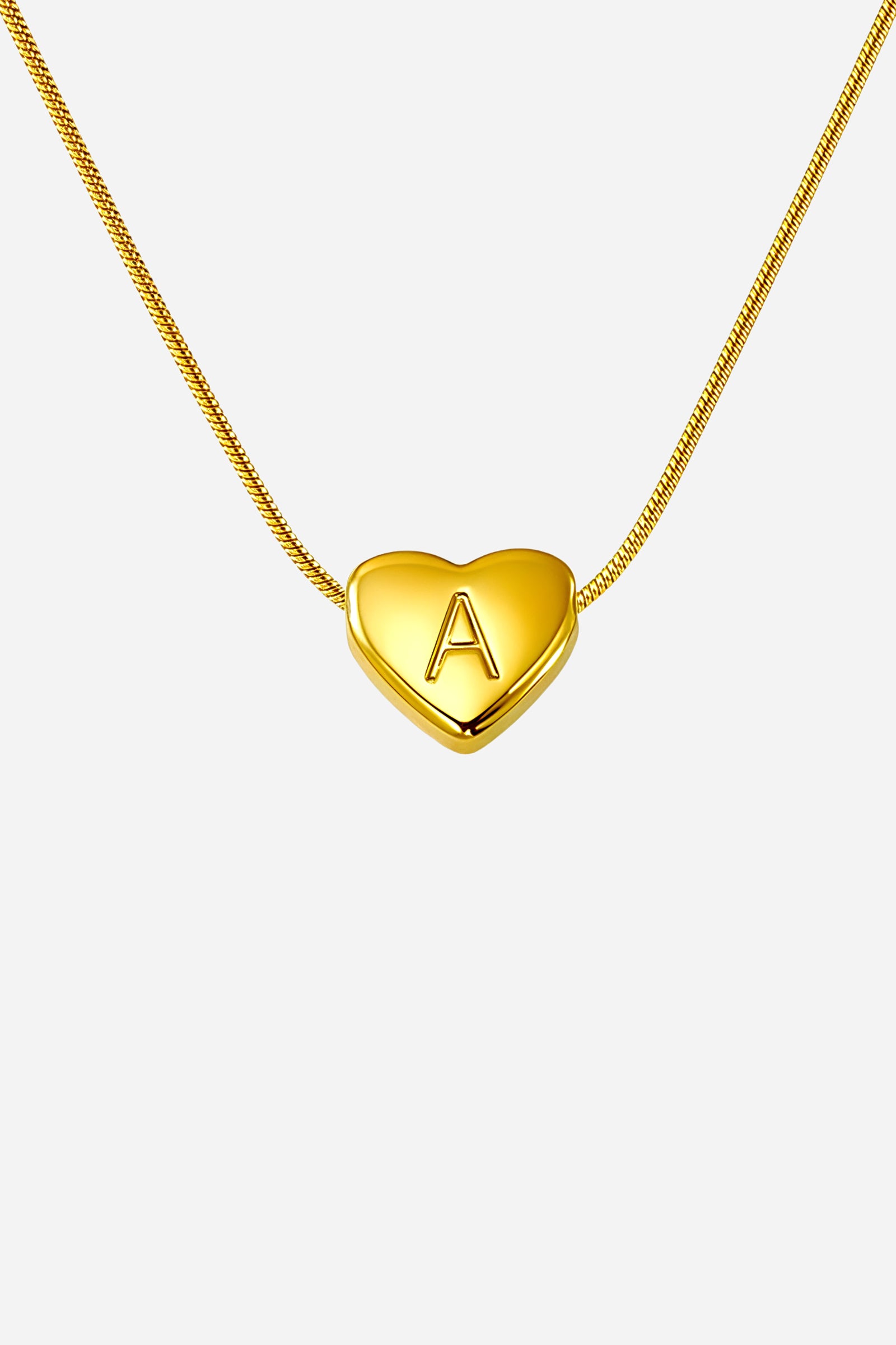 Close-up detail of gold heart initial “A” pendant necklace crafted in stainless steel with 18K PVD gold plating – GLISTIA.