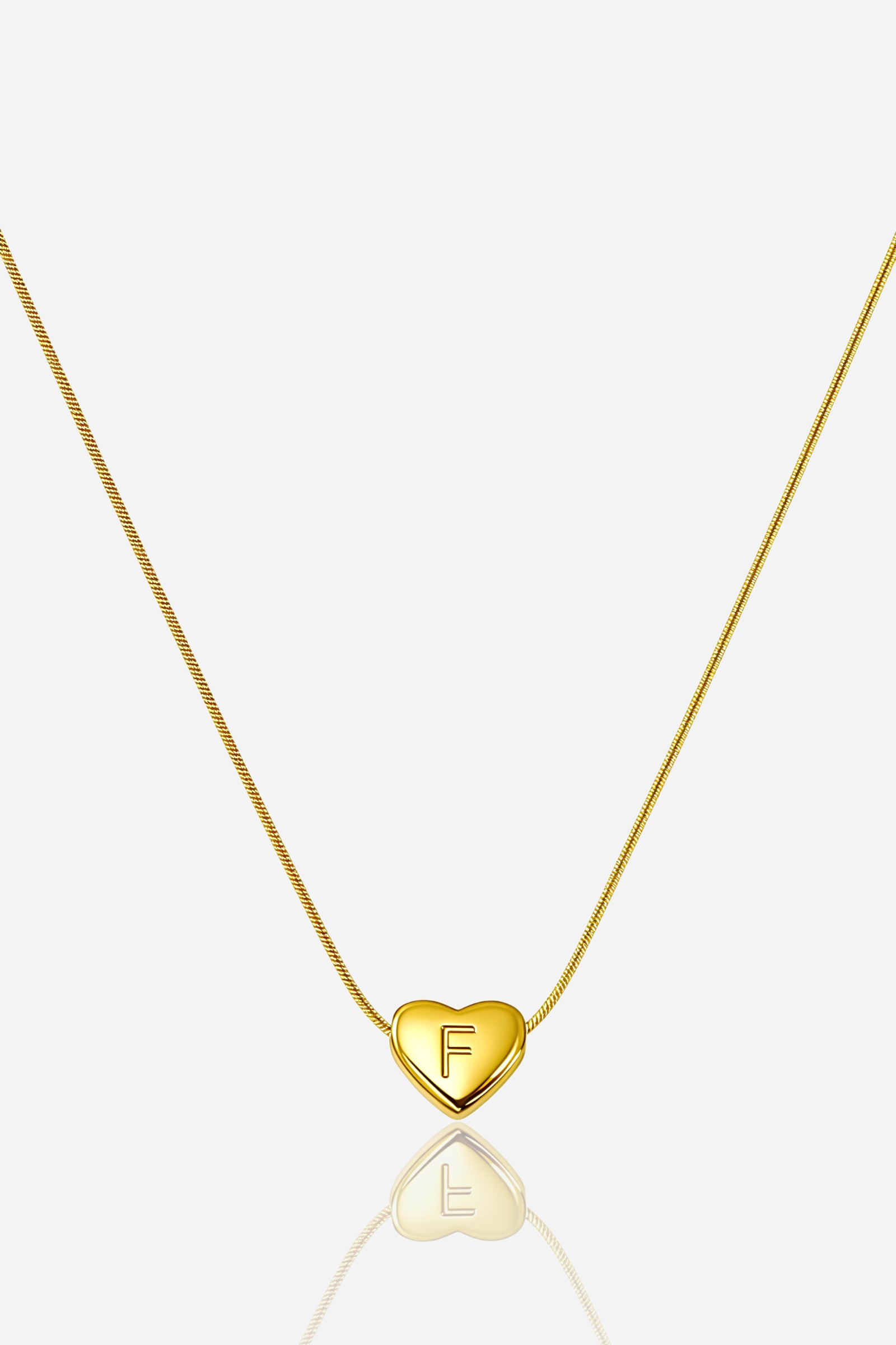 Gold-plated heart initial ‘F’ necklace with polished charm on snake chain, PVD 18K gold plated stainless steel – GLISTIA