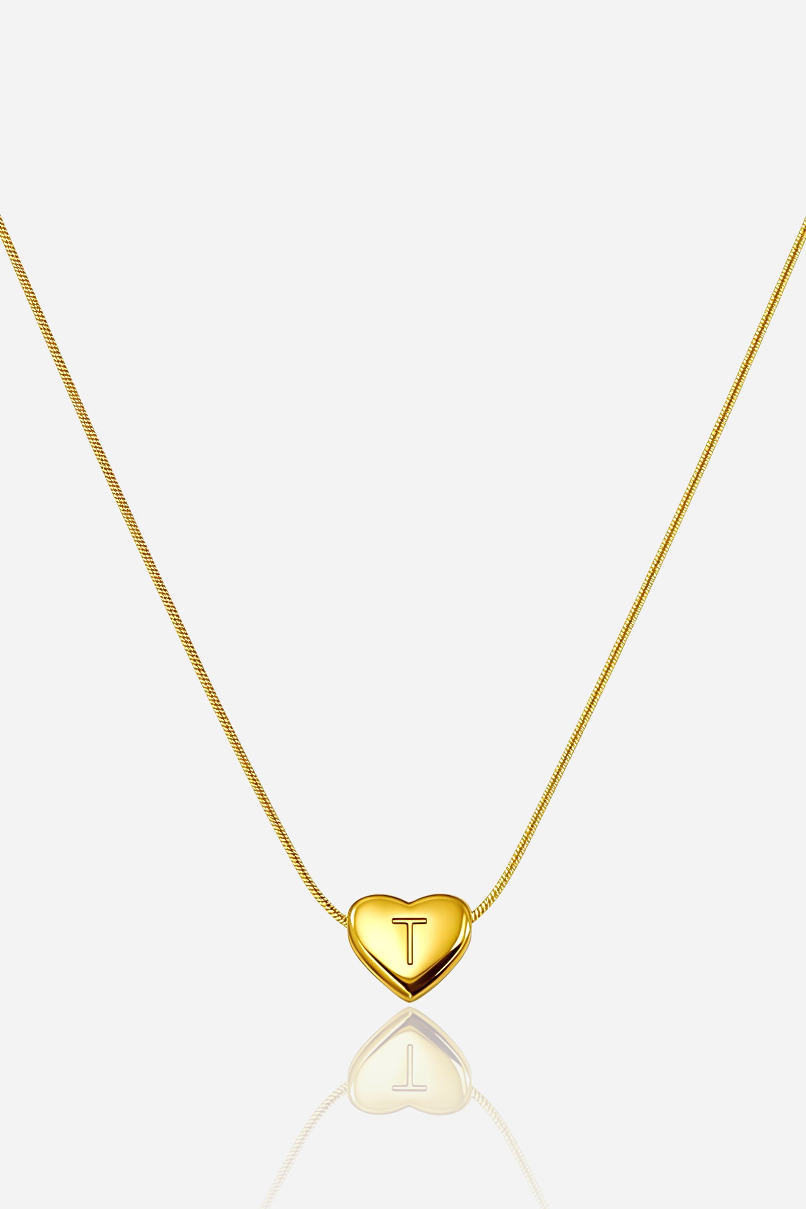 Gold-plated heart initial ‘T’ necklace with engraved pendant on a snake chain, PVD 18K gold plated stainless steel – GLISTIA