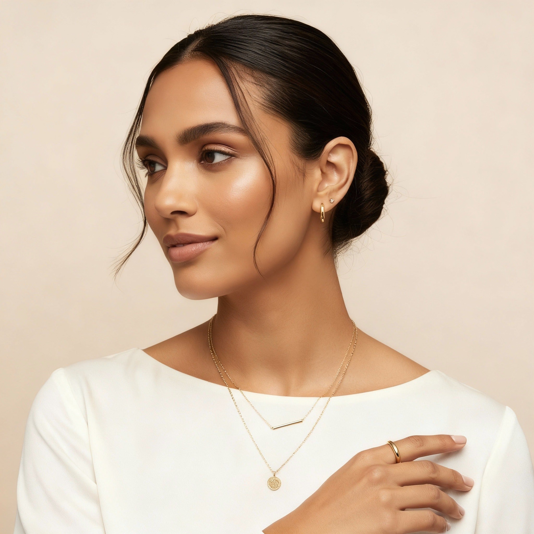 Layered necklaces styled with varying chain lengths for a modern and refined look