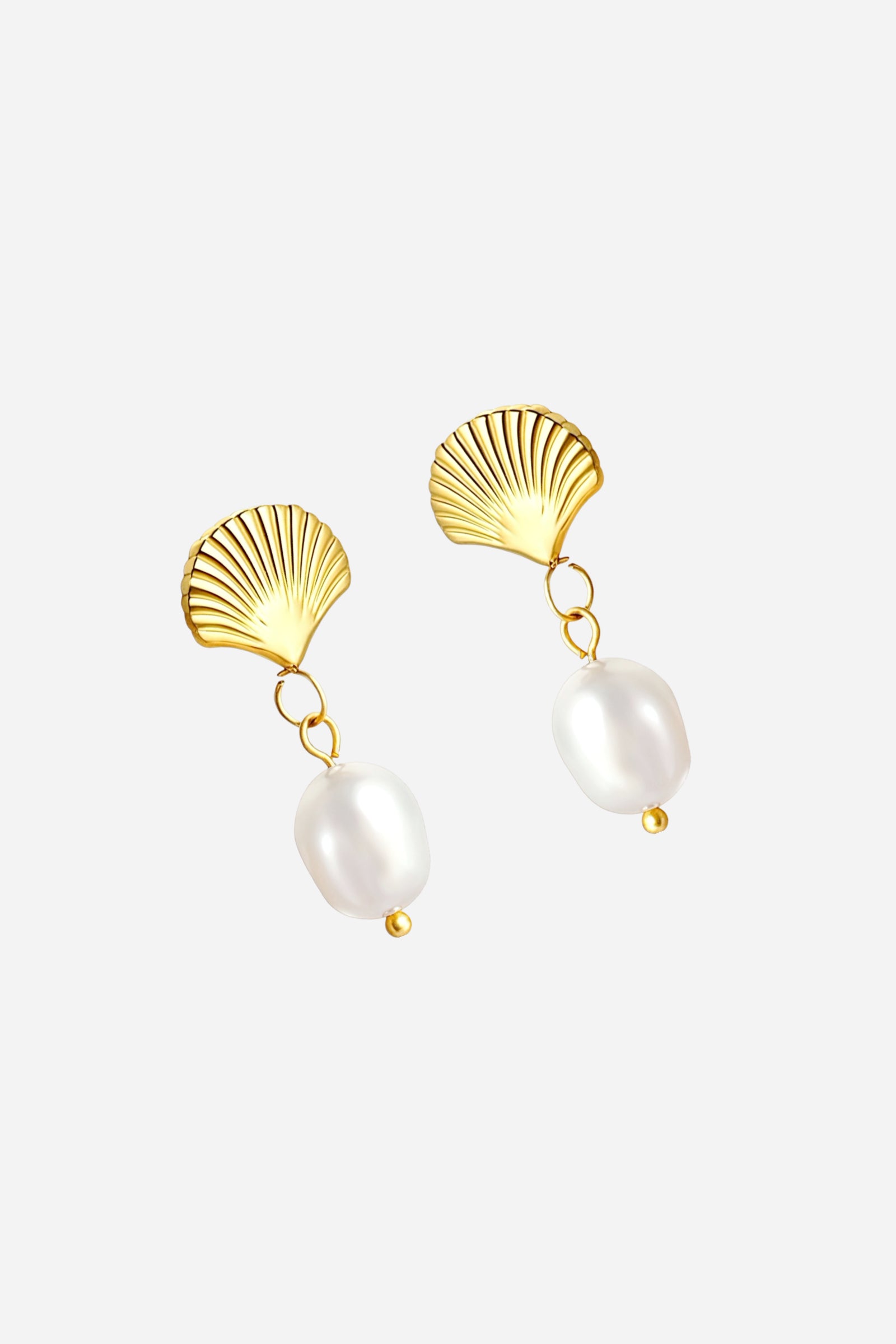 Top angled view of gold shell pearl drop earrings featuring textured fan shell tops with white pearl drops, crafted in PVD 18K gold plated stainless steel – GLISTIA.