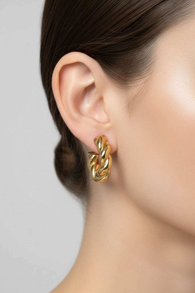Gold twisted rope C-hoop earrings crafted from stainless steel with 18K PVD gold plating, featuring a sculptural rope-inspired design and polished finish