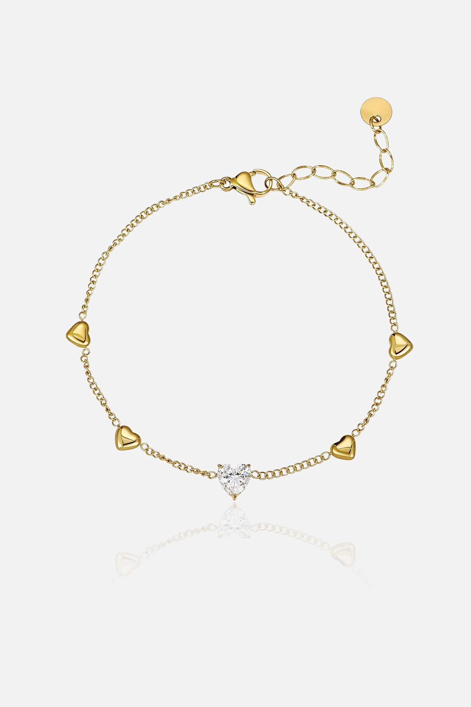 GLISTIA golden heart charm bracelet in PVD 18K gold plated stainless steel with a central crystal heart stone shown from the front.