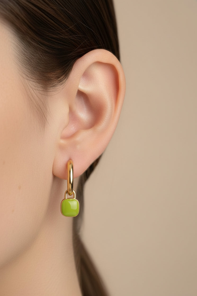 Close-up of green charm hoop earrings with 18K PVD gold plating on stainless steel, lightweight everyday hoops