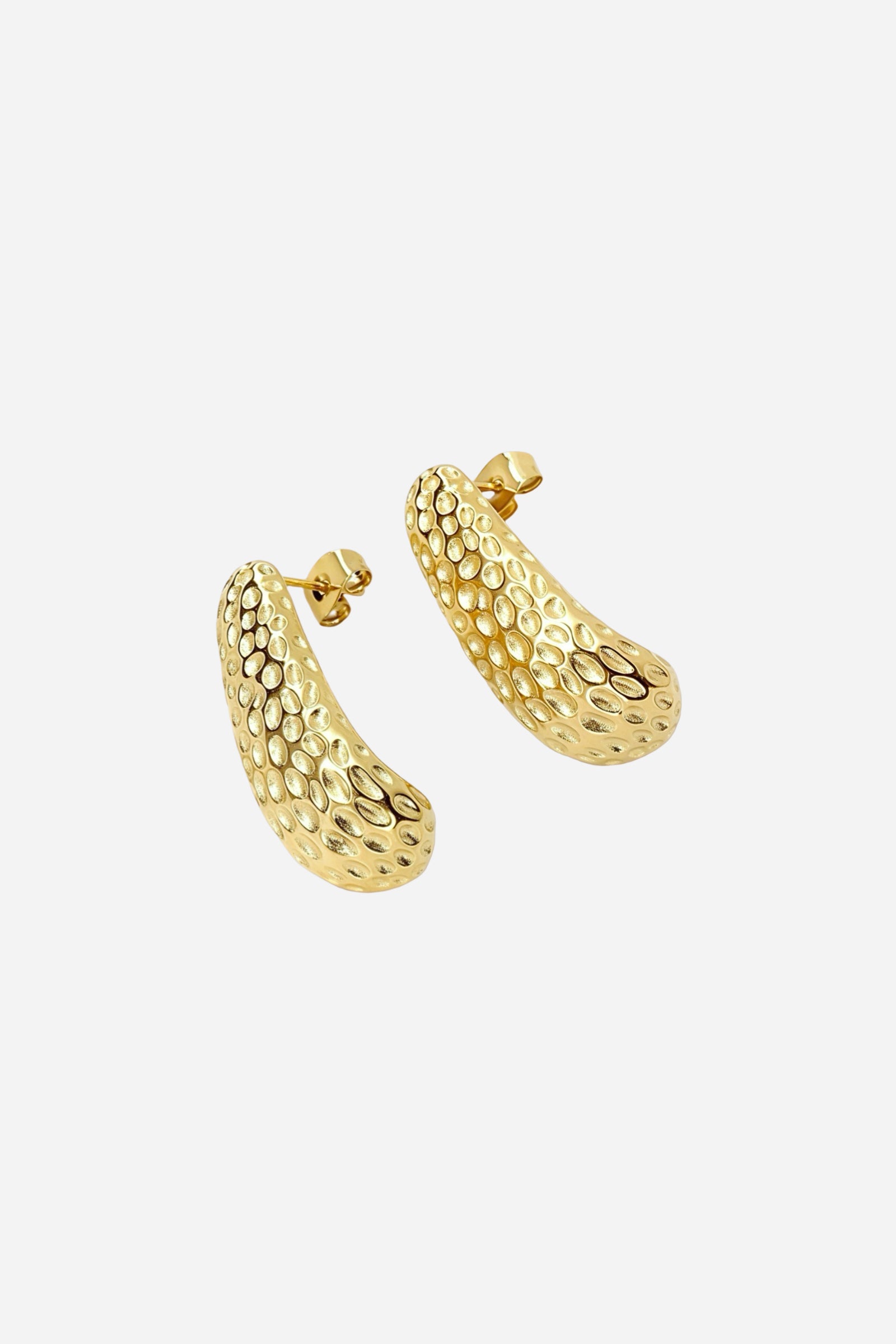 Front angled view of hammered gold curved stud earrings crafted from stainless steel with a PVD 18K gold plated finish, showcasing the raised bubble texture and sculpted contour – GLISTIA.
