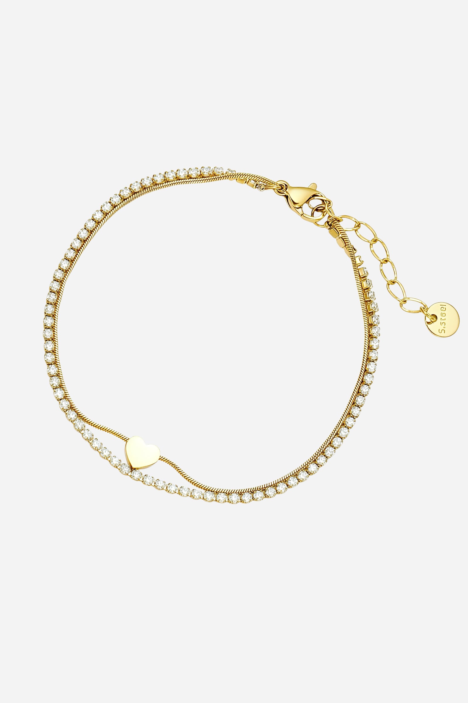 Side-angle view of the GLISTIA heart accent tennis bracelet highlighting the gold double chain and crystal detailing.