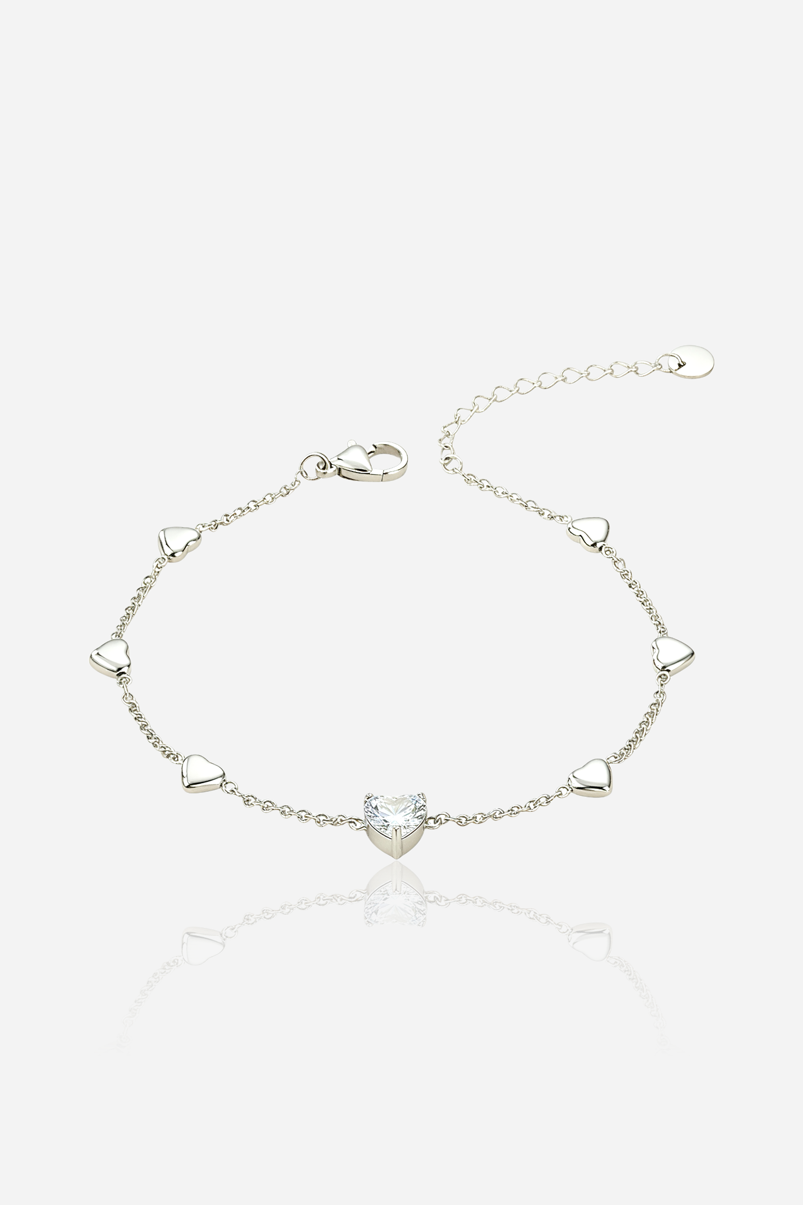 Front view of Heart Charm Chain Bracelet in silver tone, stainless steel with central heart stone and mini heart charms by GLISTIA.