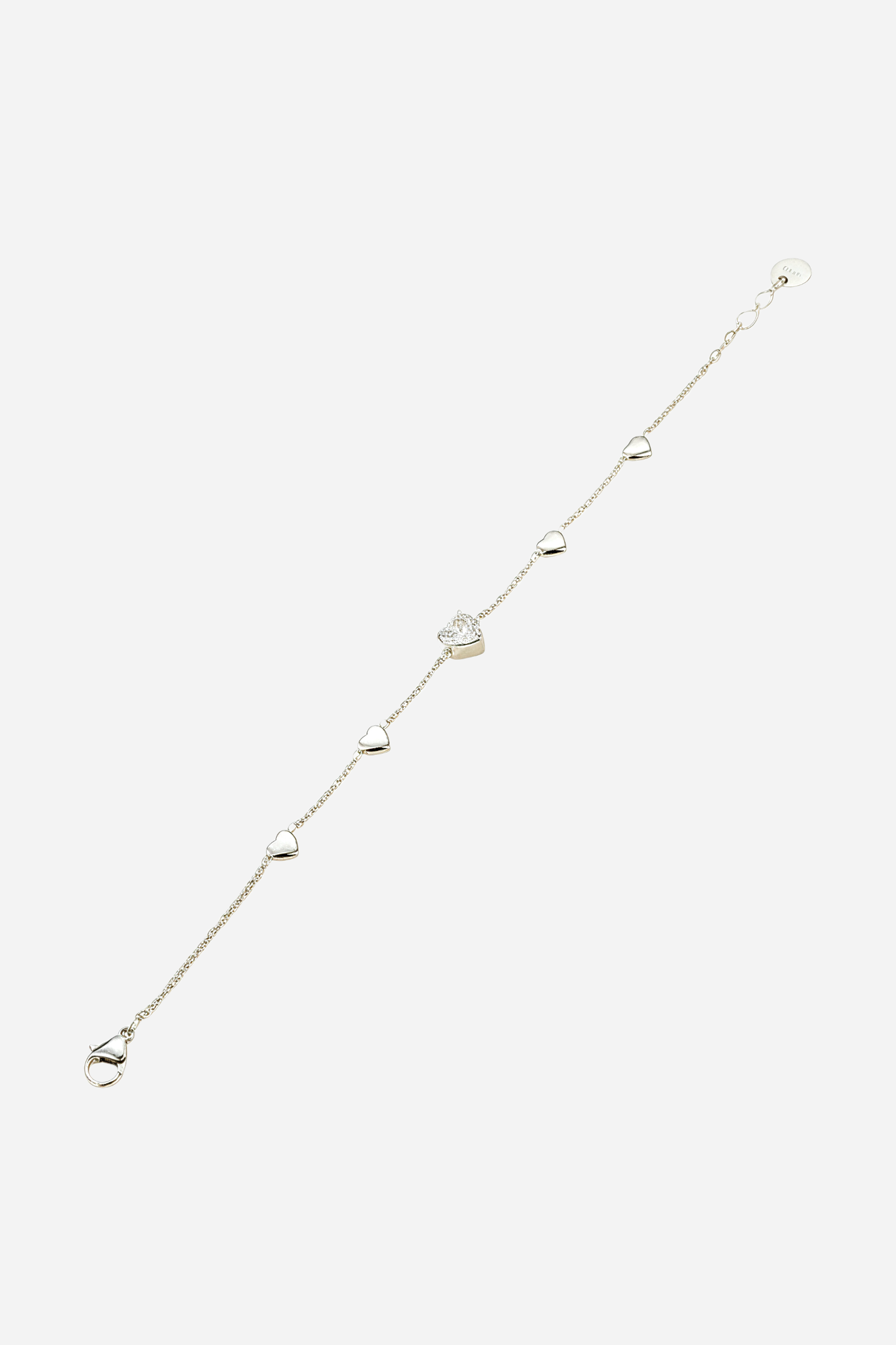 Side angle of silver tone Heart Charm Chain Bracelet featuring stainless steel chain and heart charms by GLISTIA