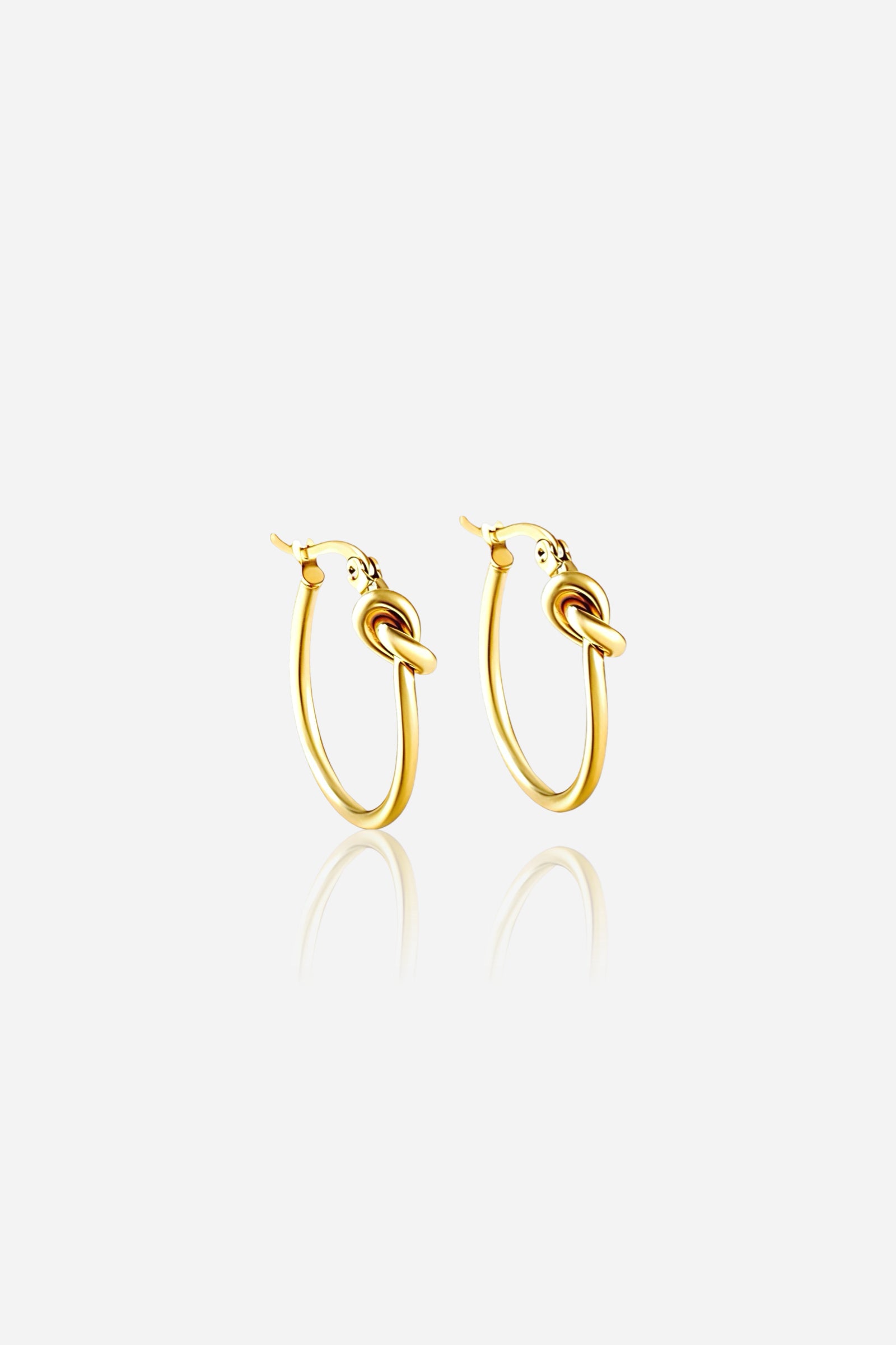 Front view of knot hoop earrings in 18K gold plated stainless steel featuring a sleek classic loop with knot detail – GLISTIA jewellery