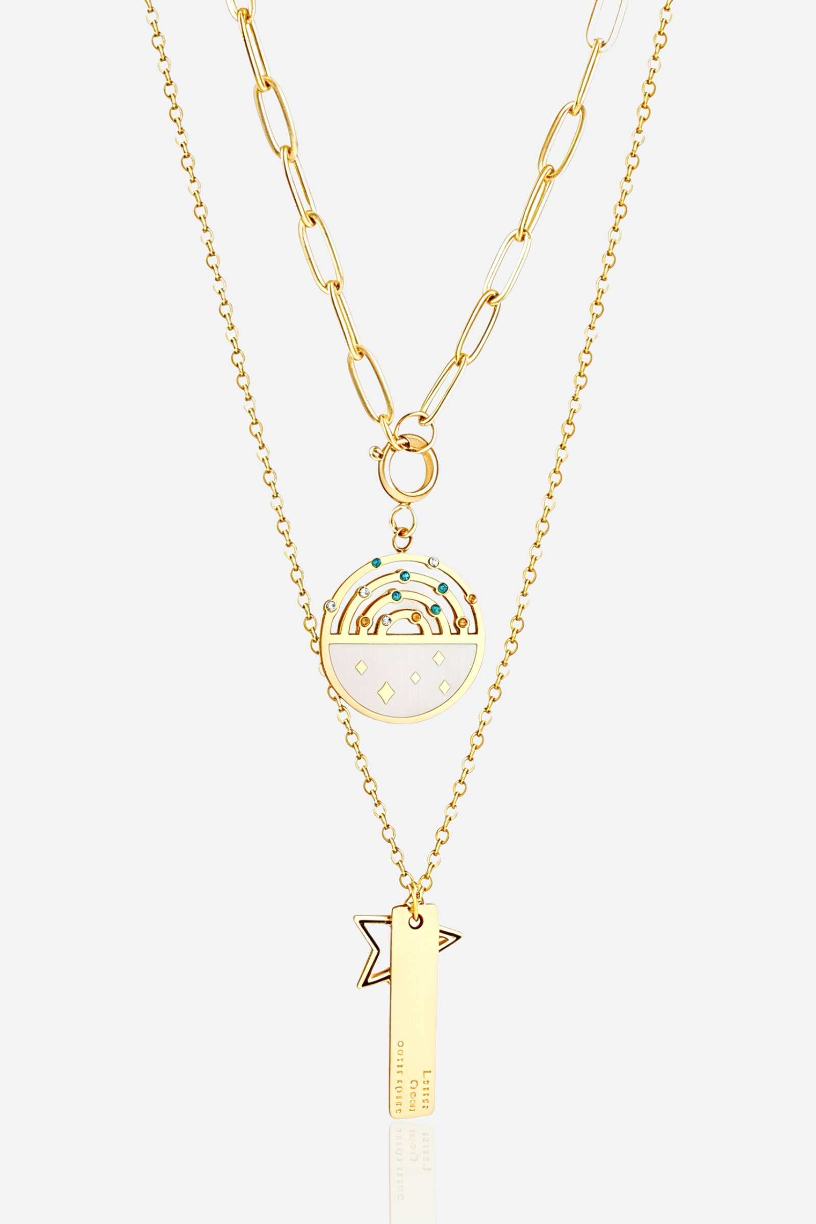 Close-up of GLISTIA Layered Rainbow & Star Charm Necklace showing coloured stone accents and polished gold tone.
