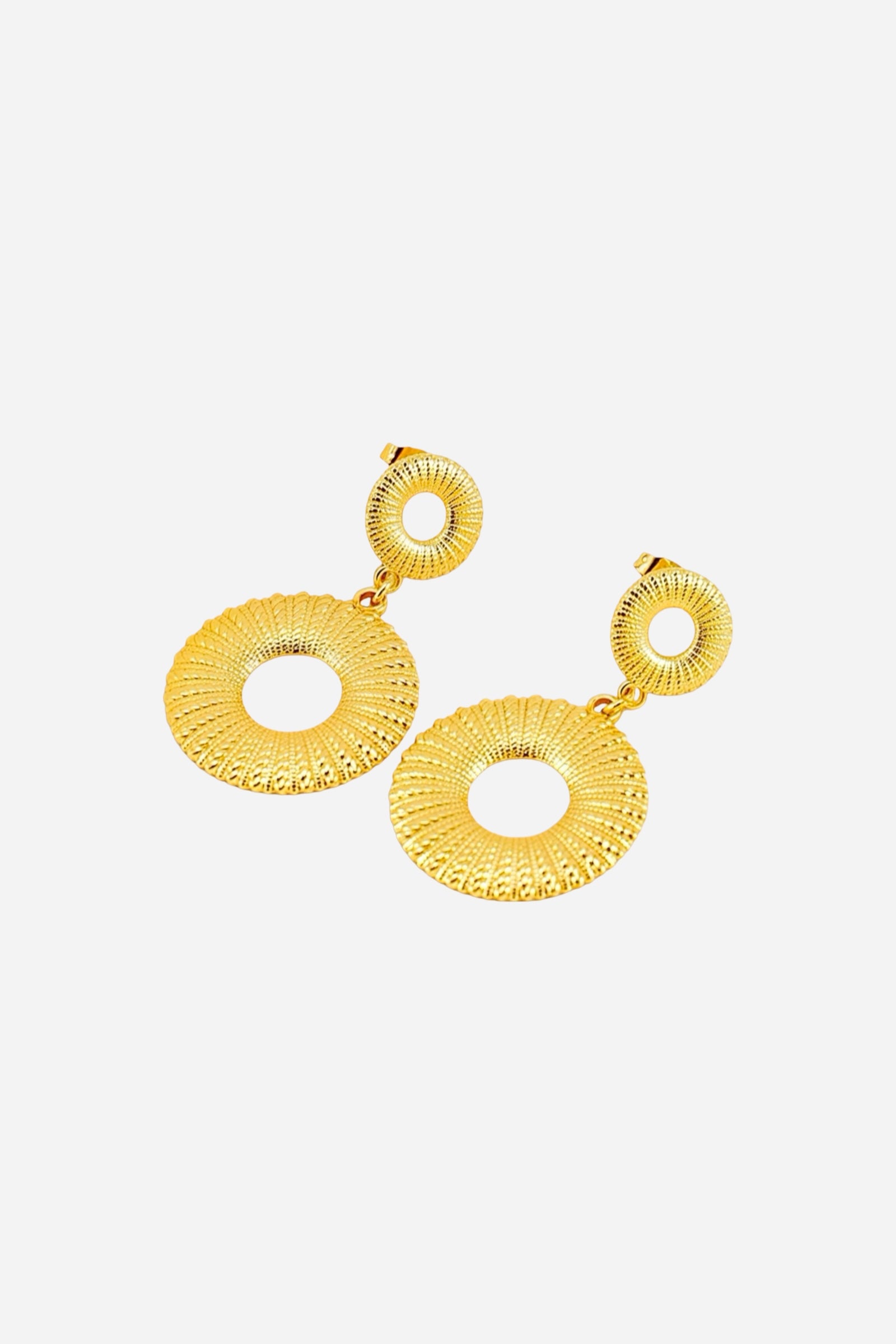 Side-angle view of Liora Circle Drop Earrings made from stainless steel with a radiant PVD 18K gold-plated finish, featuring textured circular open design - GLISTIA.