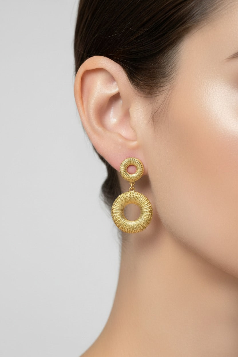 Liora Circle Drop Earrings crafted from stainless steel with 18K PVD gold plating, featuring a textured open circle drop design.