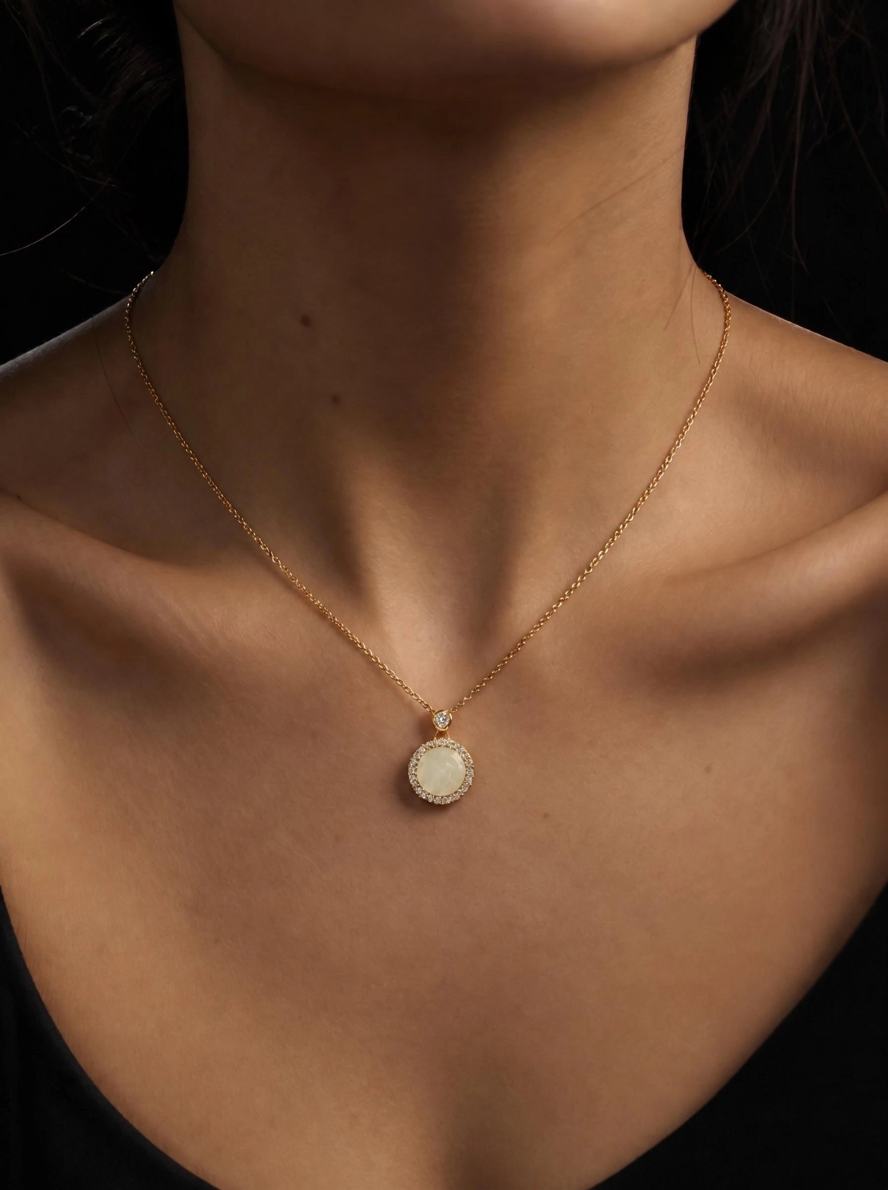 Luna Halo Pendant Necklace with a round pearl-style centre and sparkling halo detail on a delicate gold chain by GLISTIA.