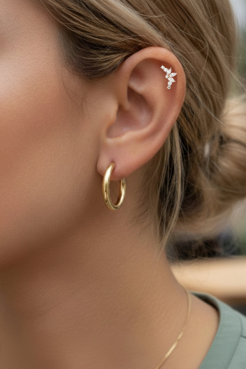 Marquise cluster stud earring crafted from stainless steel with 18K PVD gold plating, featuring marquise and round cubic zirconia crystals in a refined cluster design