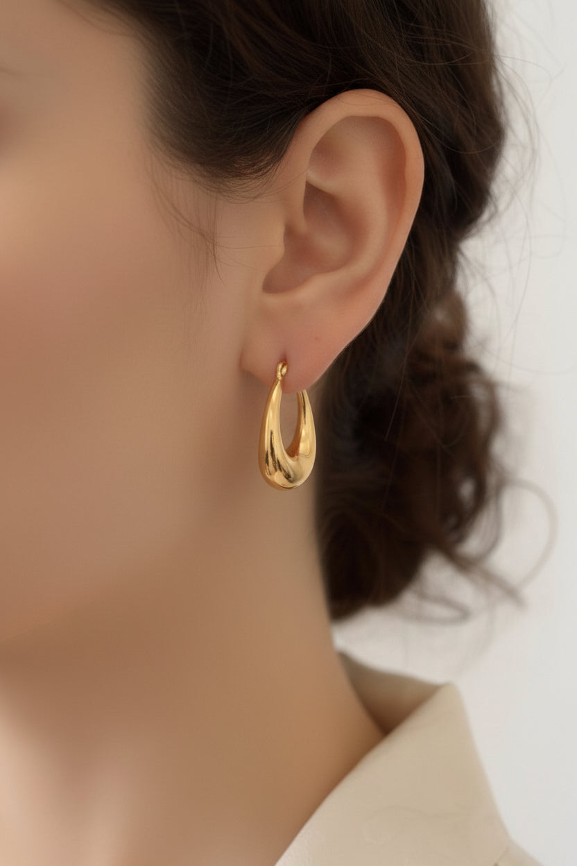 mini-teardrop-Chunky hoop earrings with high polish 18K PVD gold plating shown from side profile on ear
