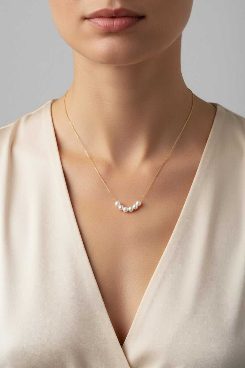 Minimalist pearl bar necklace on an ultra thin chain in 18K PVD gold plated stainless steel