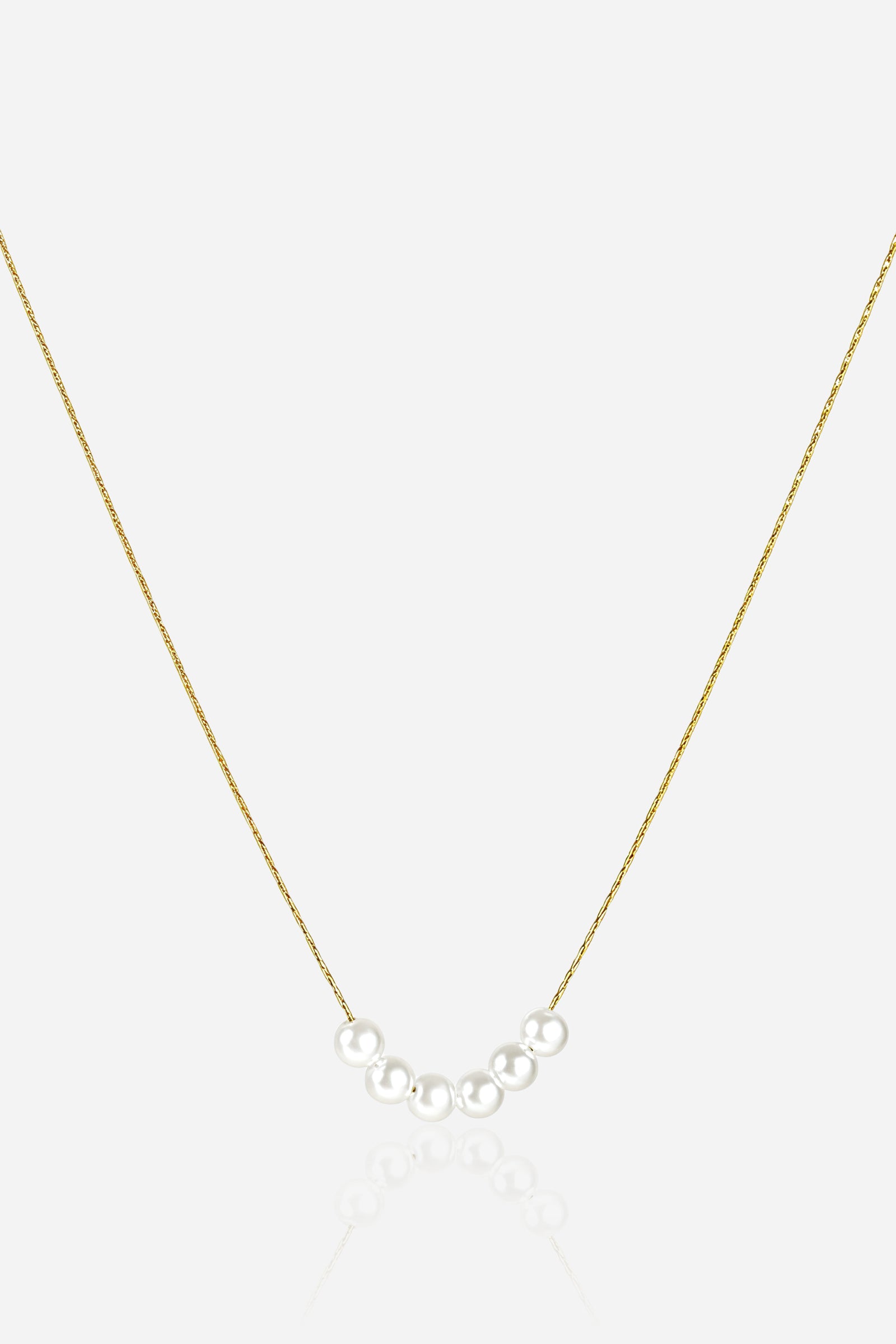 Minimalist pearl bar necklace with five white pearls on an ultra-thin 18K PVD gold-plated stainless-steel chain – GLISTIA.