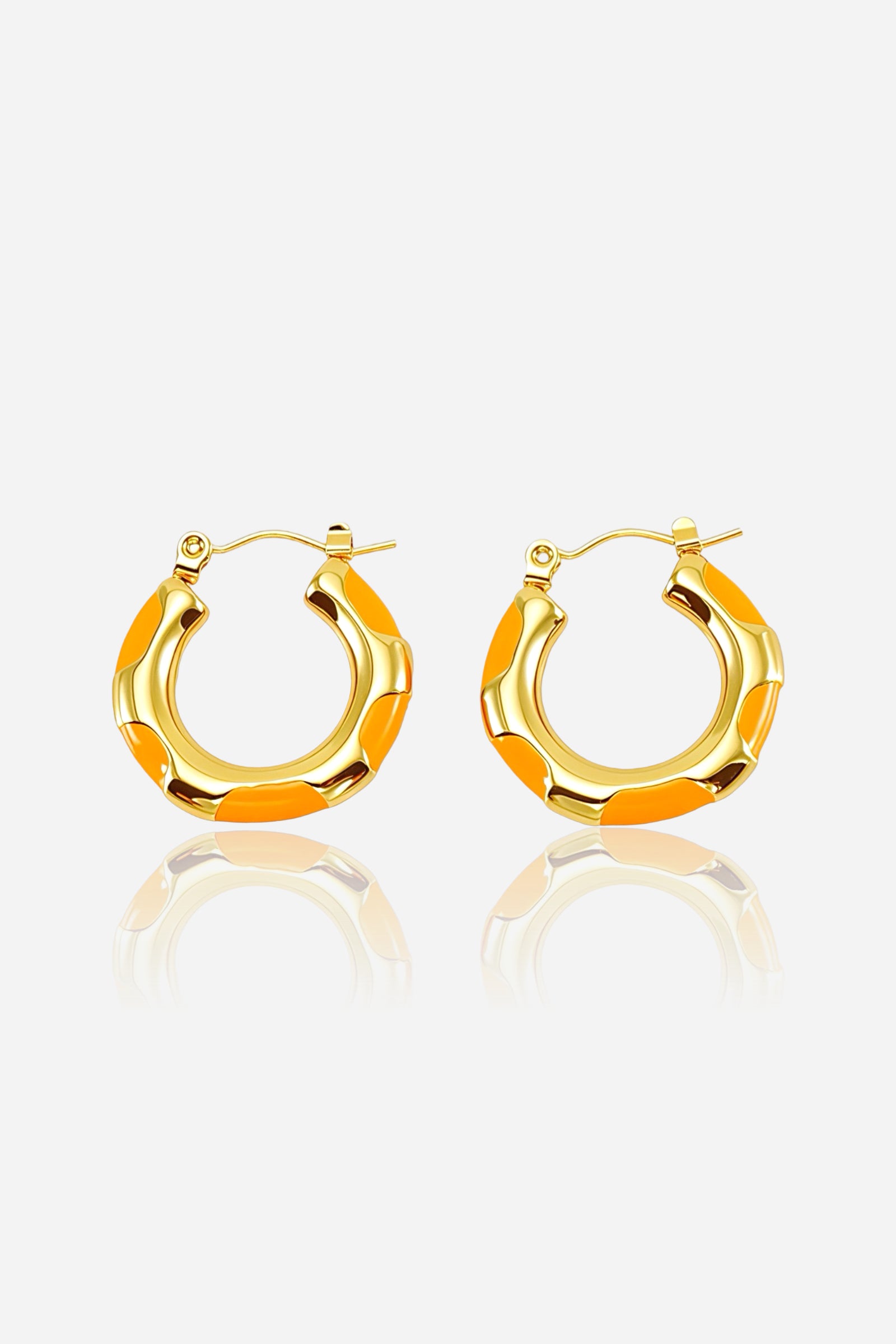 Front view of orange bamboo hoop earrings crafted from stainless steel with a PVD 18K gold plated finish, featuring bold orange enamel accents in a bamboo-inspired design – GLISTIA