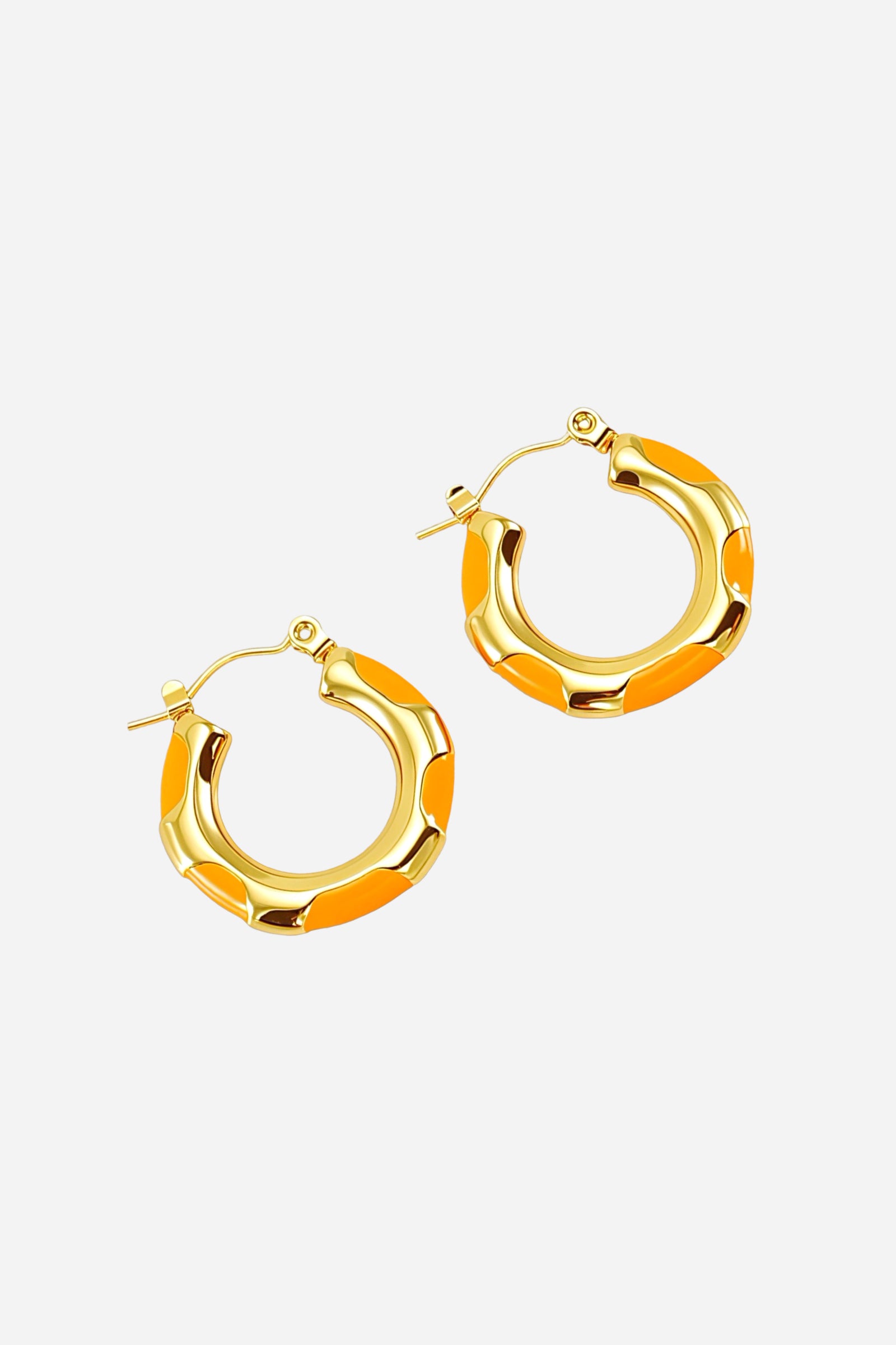 Top view of orange bamboo hoop earrings crafted in stainless steel with PVD 18K gold plating, showcasing smooth orange enamel accents and a polished rounded bamboo-inspired design – GLISTIA