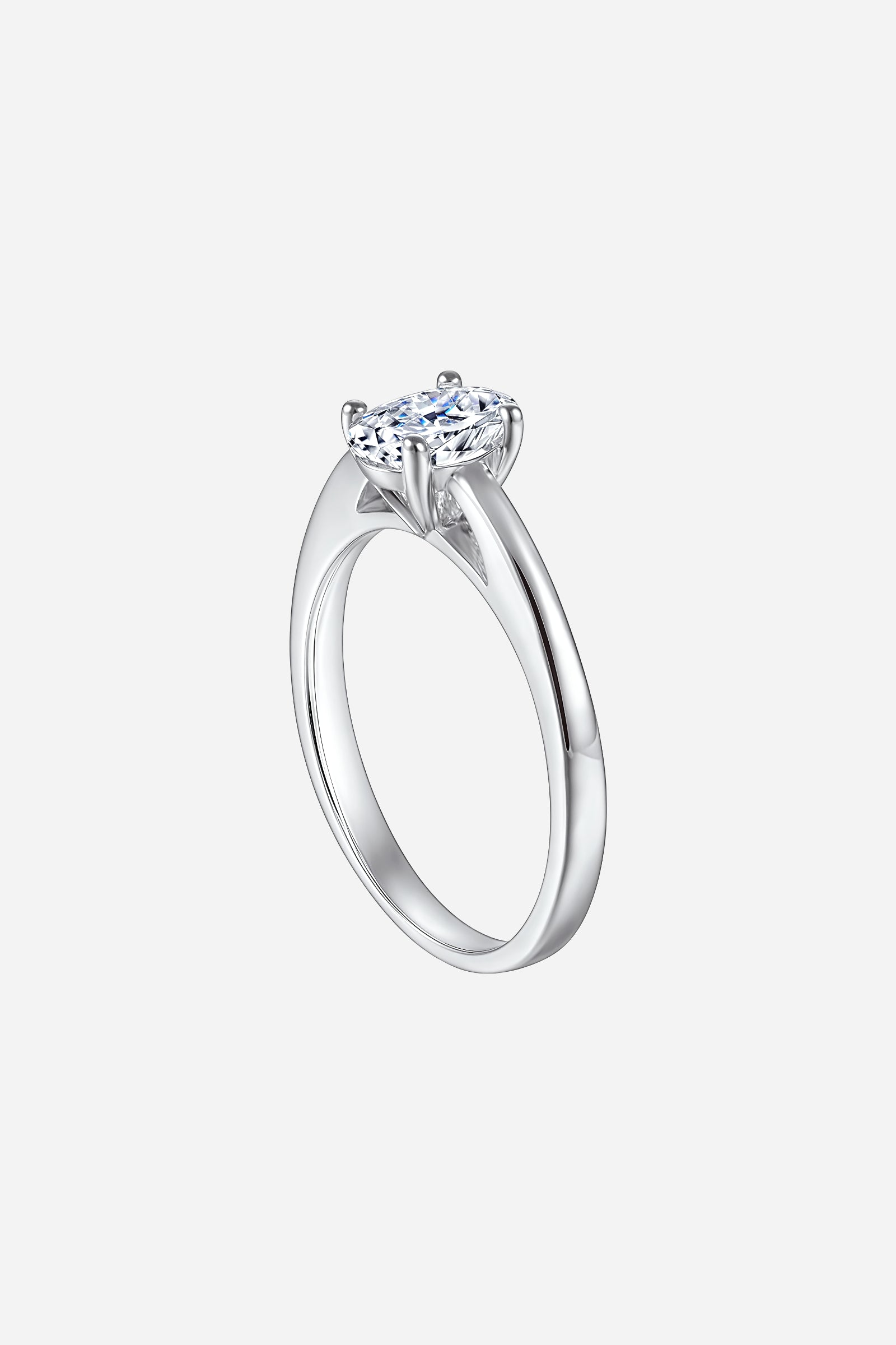 Side-angle image of GLISTIA Oval-Cut Solitaire Zircon Ring showcasing the polished silver band and elegant elongated zircon.