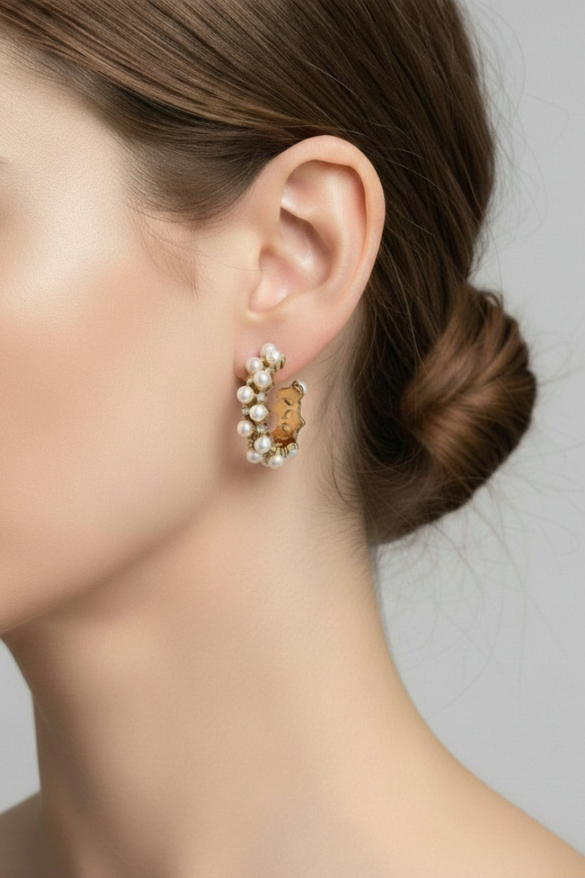 Close-up of GLISTIA pearl and crystal hoop earrings with cubic zirconia accents, 18K PVD gold plated stainless steel