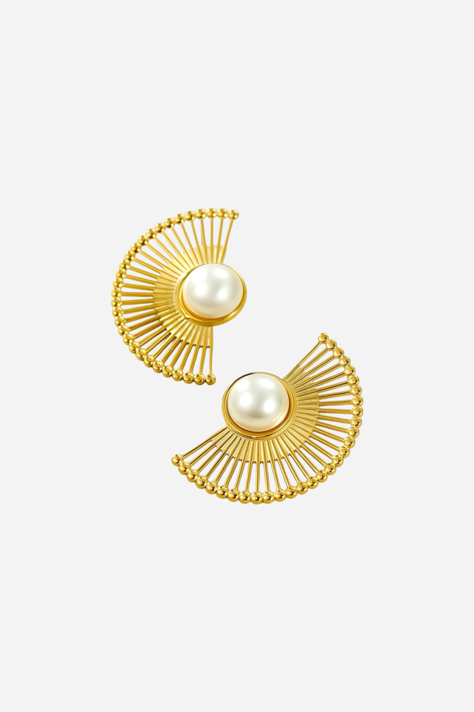 Angled view of radiant fan pearl earrings crafted from stainless steel with PVD 18K gold plating, showcasing the pearl centre and fan-like golden frame – GLISTIA.