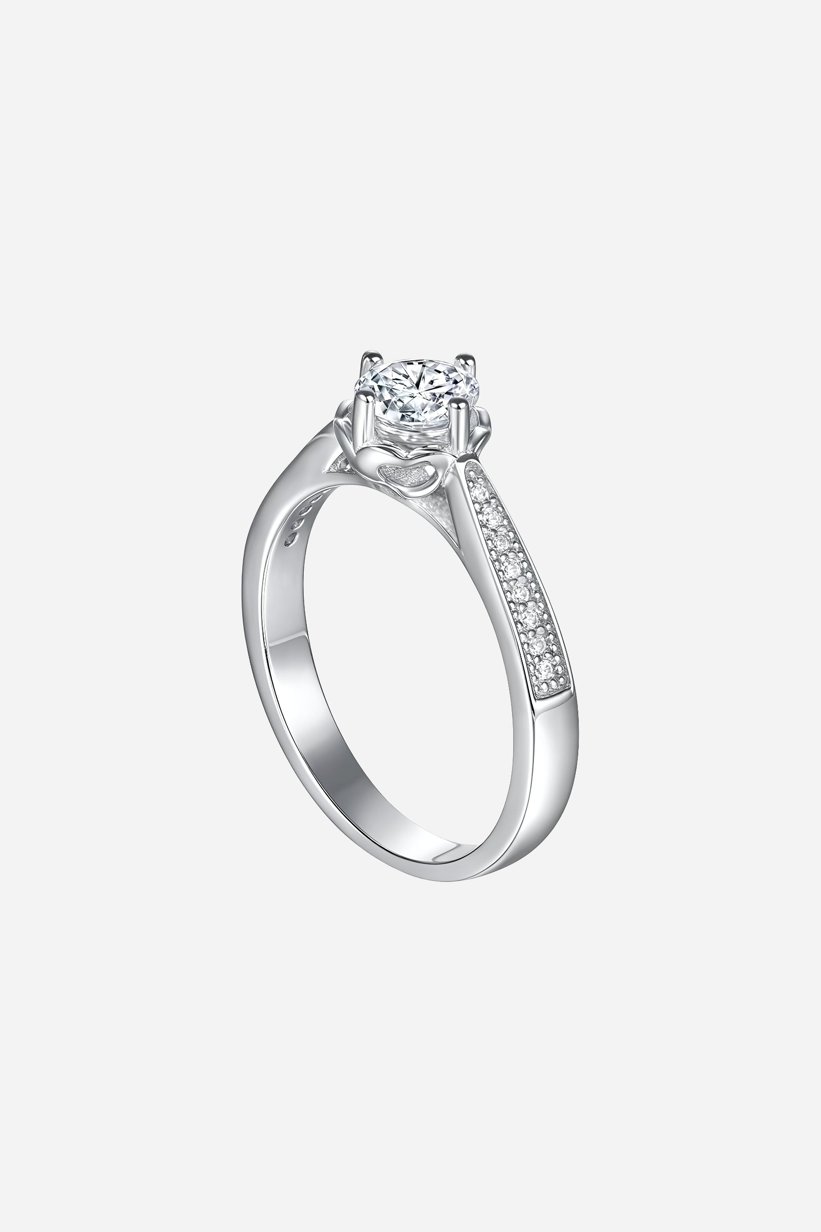 Side-angle image of GLISTIA Round-Cut Solitaire Ring showcasing the polished silver band and elevated prong-set zircon.
