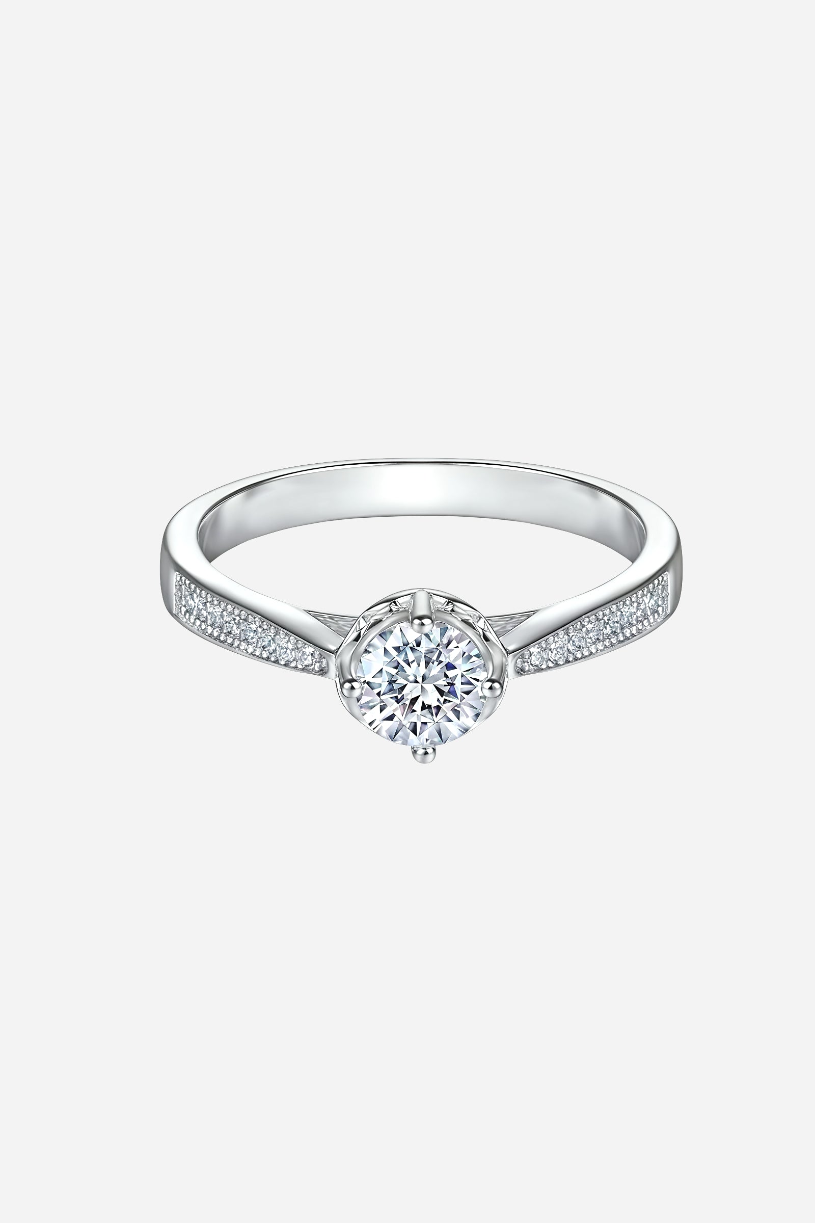 Top-view of GLISTIA sterling silver round solitaire ring featuring a high-gloss mirror finish and pavé-accented shoulders.