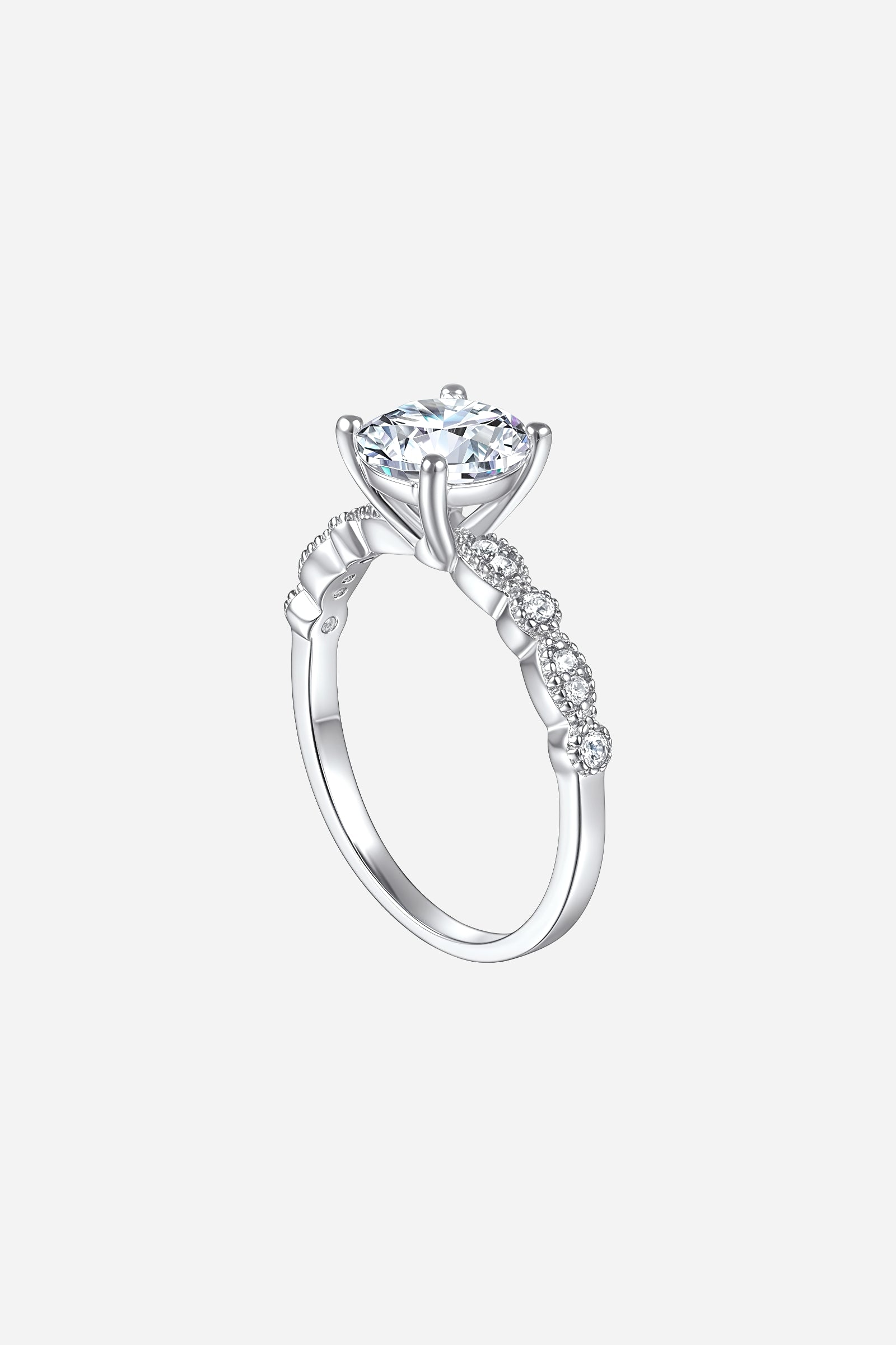 Side-angle image of GLISTIA Round-Cut Solitaire Zircon Twist Band Ring showcasing the elegant, twisted band and raised prong setting.