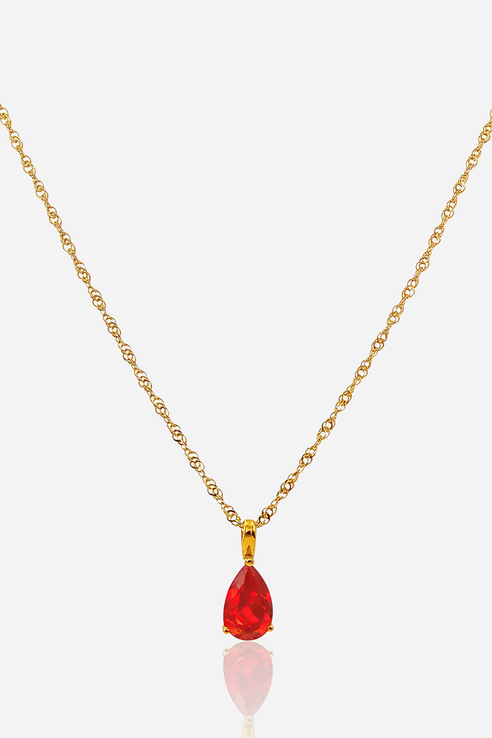 Siam Birthstone Necklace January in stainless steel with 18K gold plating, front view showing teardrop red crystal pendant