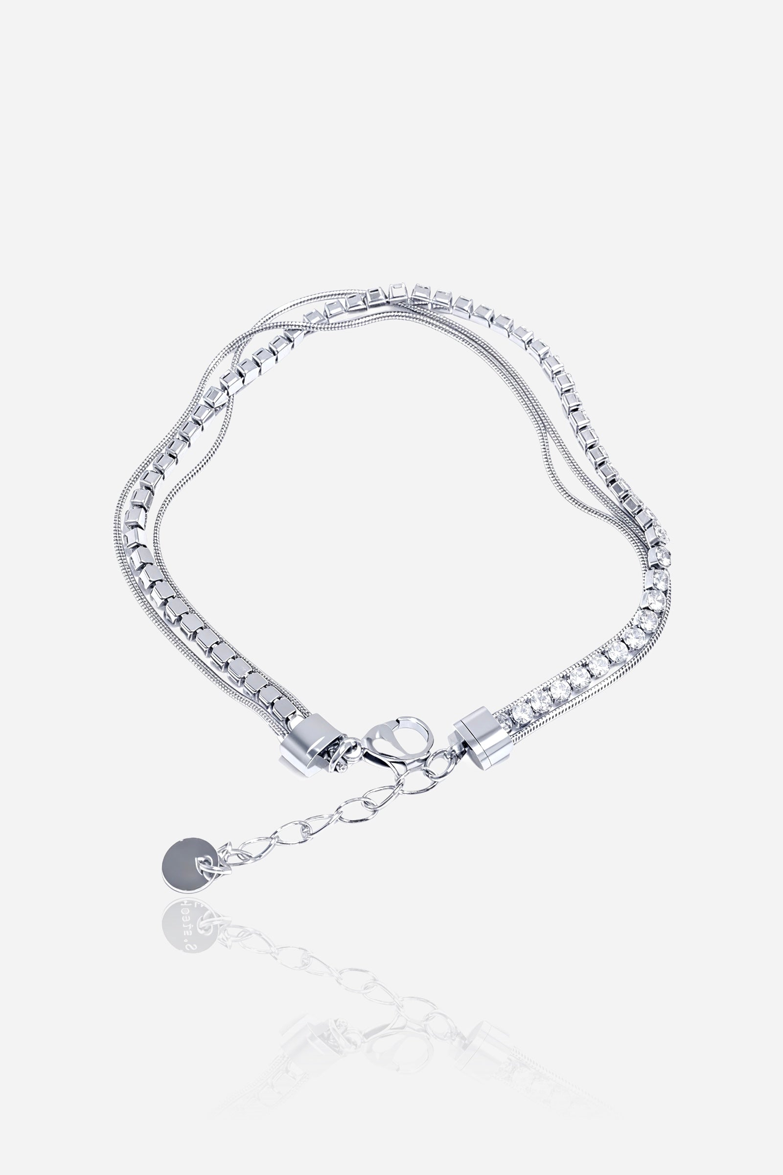 GLISTIA silver dual chain tennis bracelet in polished stainless steel shown from the front, featuring a central crystal tennis row.