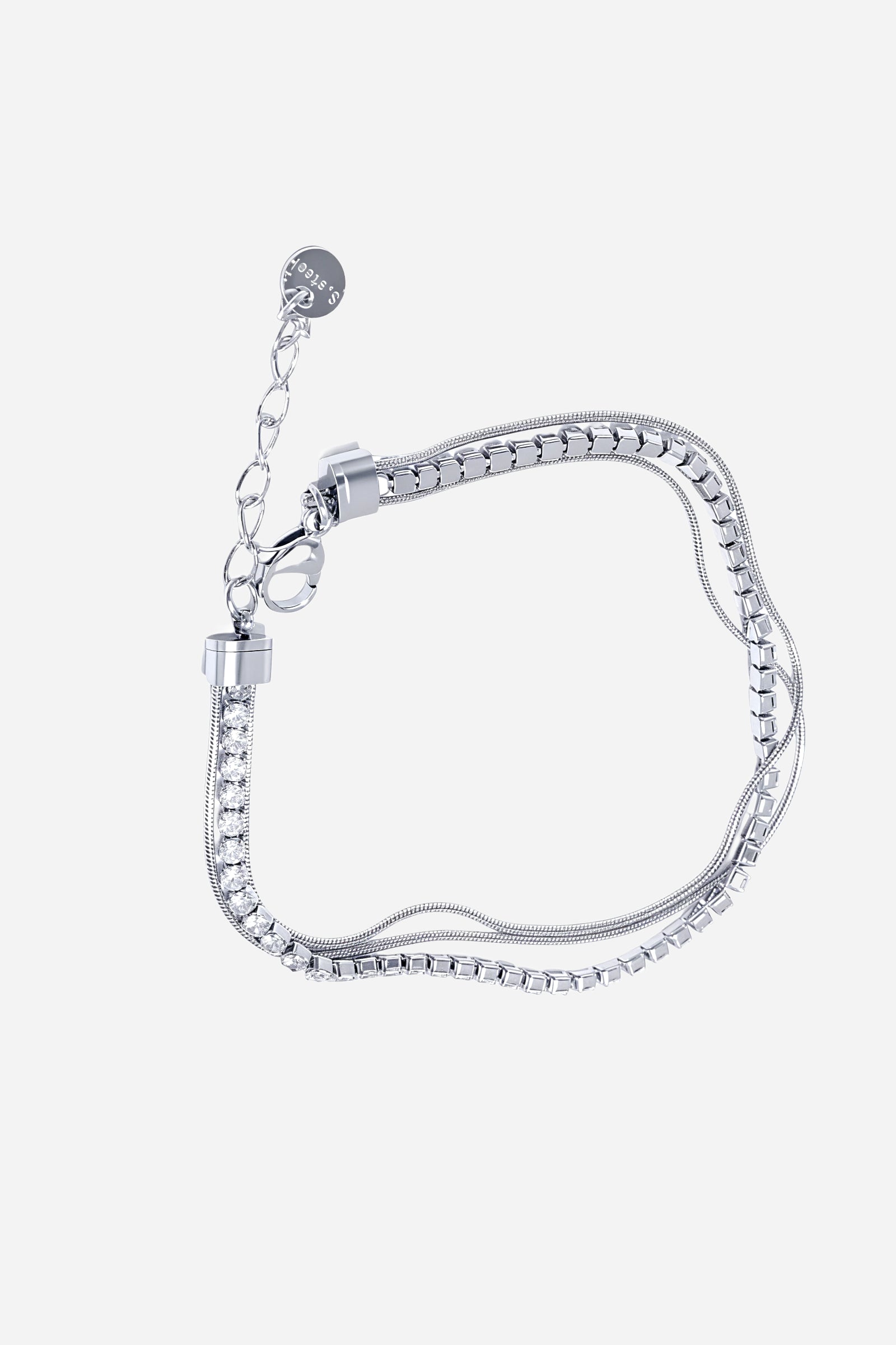 Side-angle view of the GLISTIA polished stainless steel tennis bracelet highlighting the sleek dual chain design.