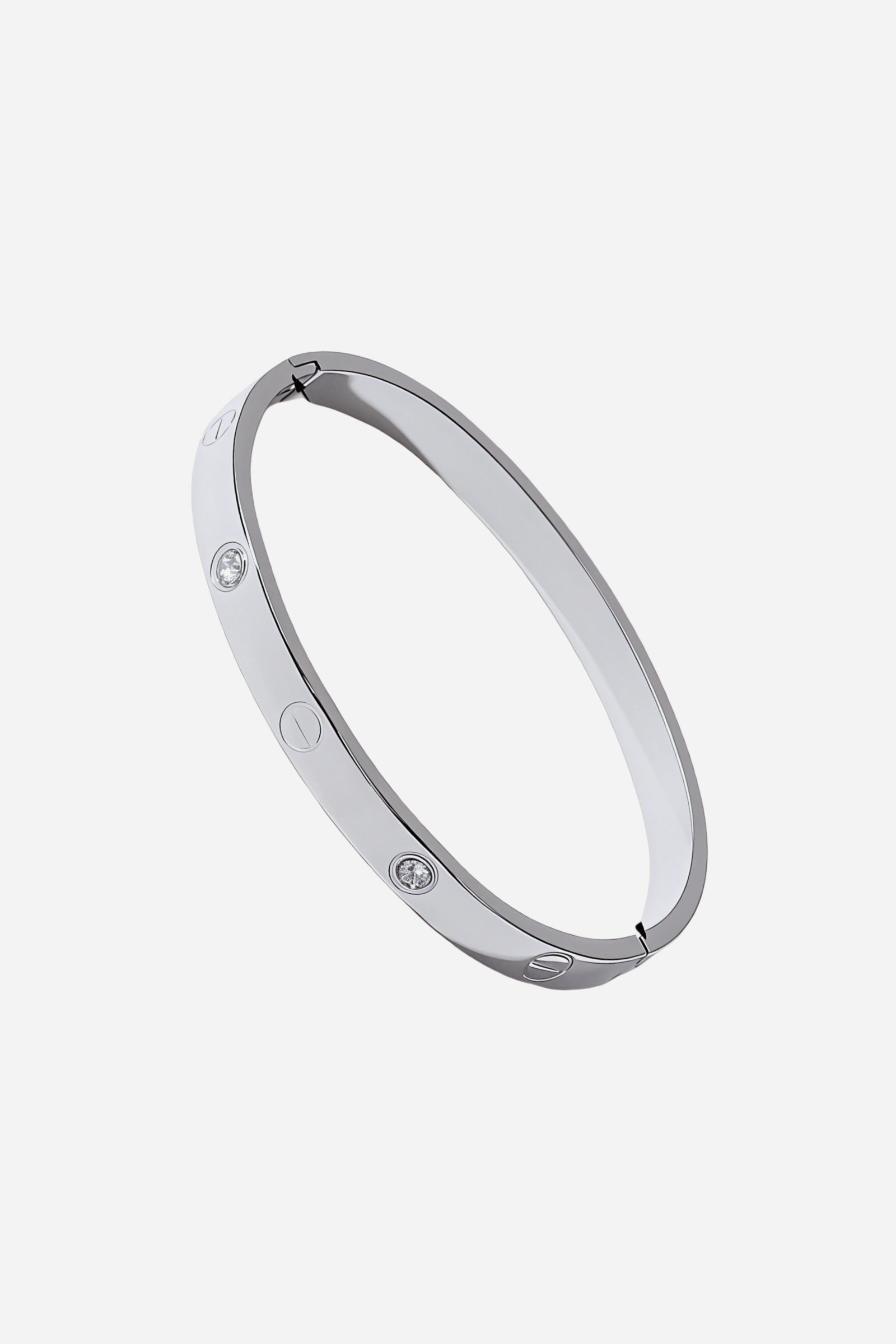 Top view of the silver stainless steel bangle featuring alternating screw motifs and cubic zirconia crystals – GLISTIA.