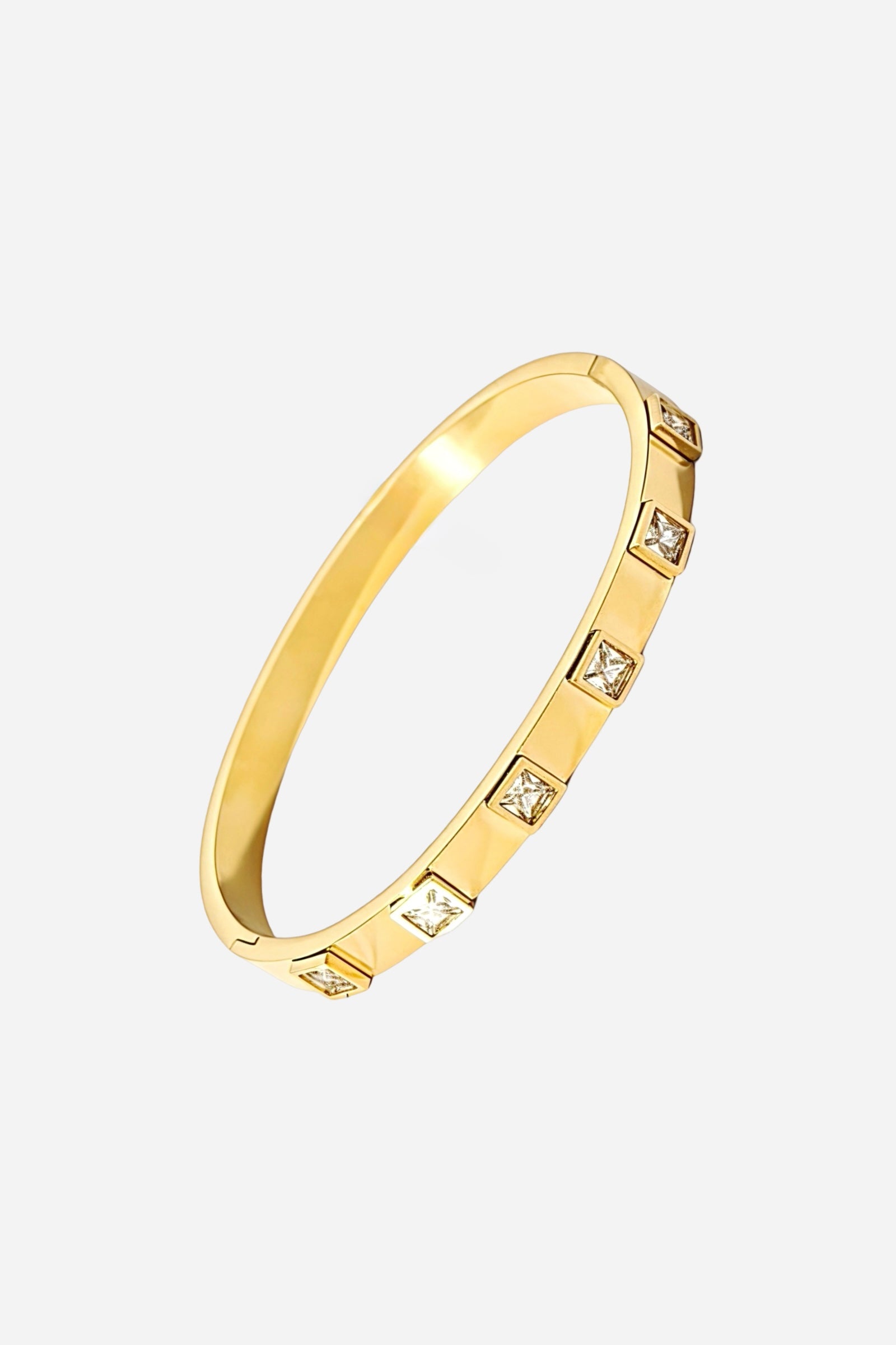 Top view of the Square-Cut Crystal Bangle highlighting its linear arrangement of sparkling stones and high-polish gold finish - GLISTIA.