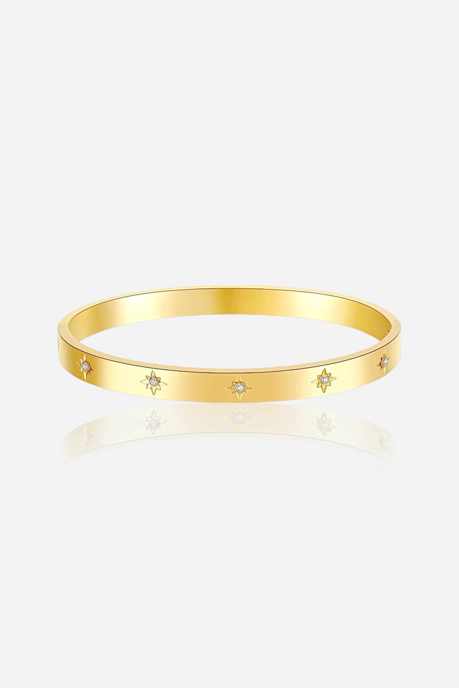 Front view of GLISTIA Starburst Engraved Crystal Bangle crafted from stainless steel with a PVD 18K gold plated finish, featuring engraved star motifs accented with cubic zirconia stones