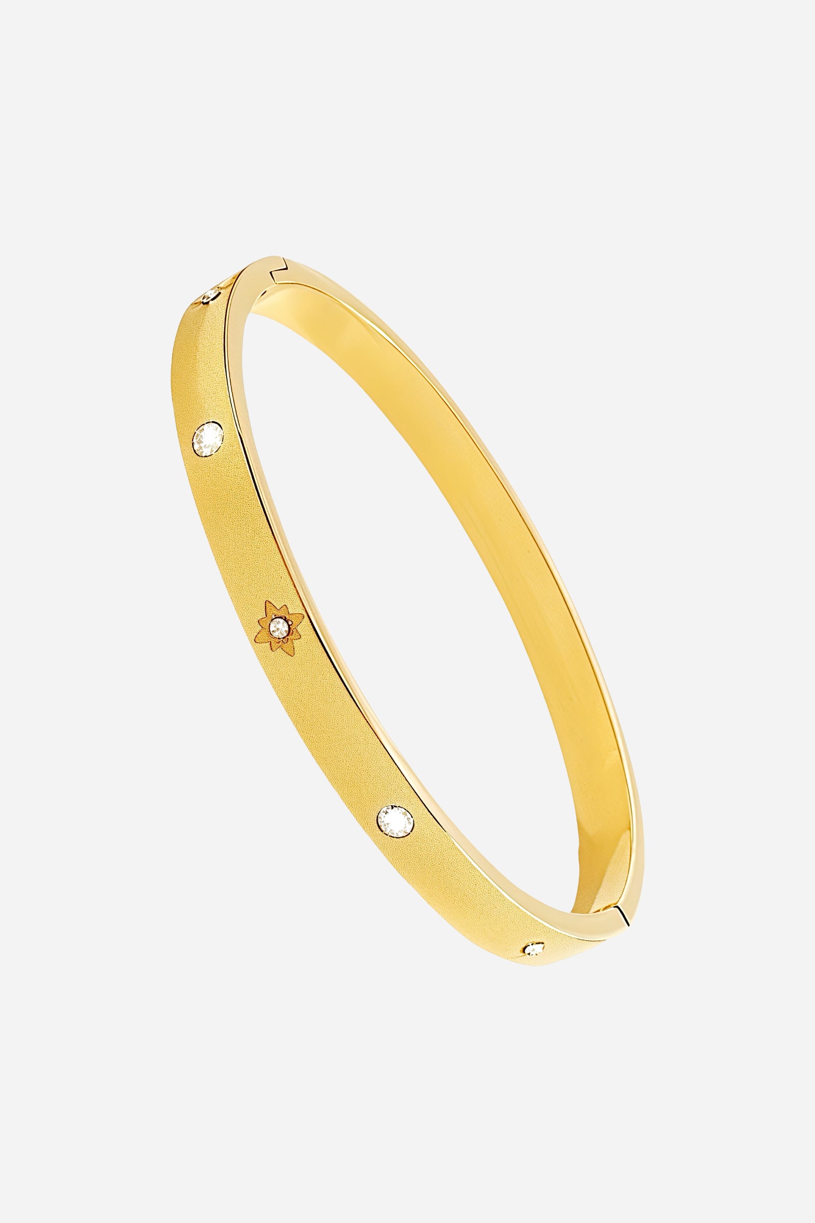 Top view of the 18K gold plated Stardust Crystal Bangle showcasing its symmetrical star engravings and high-shine finish - GLISTIA.
