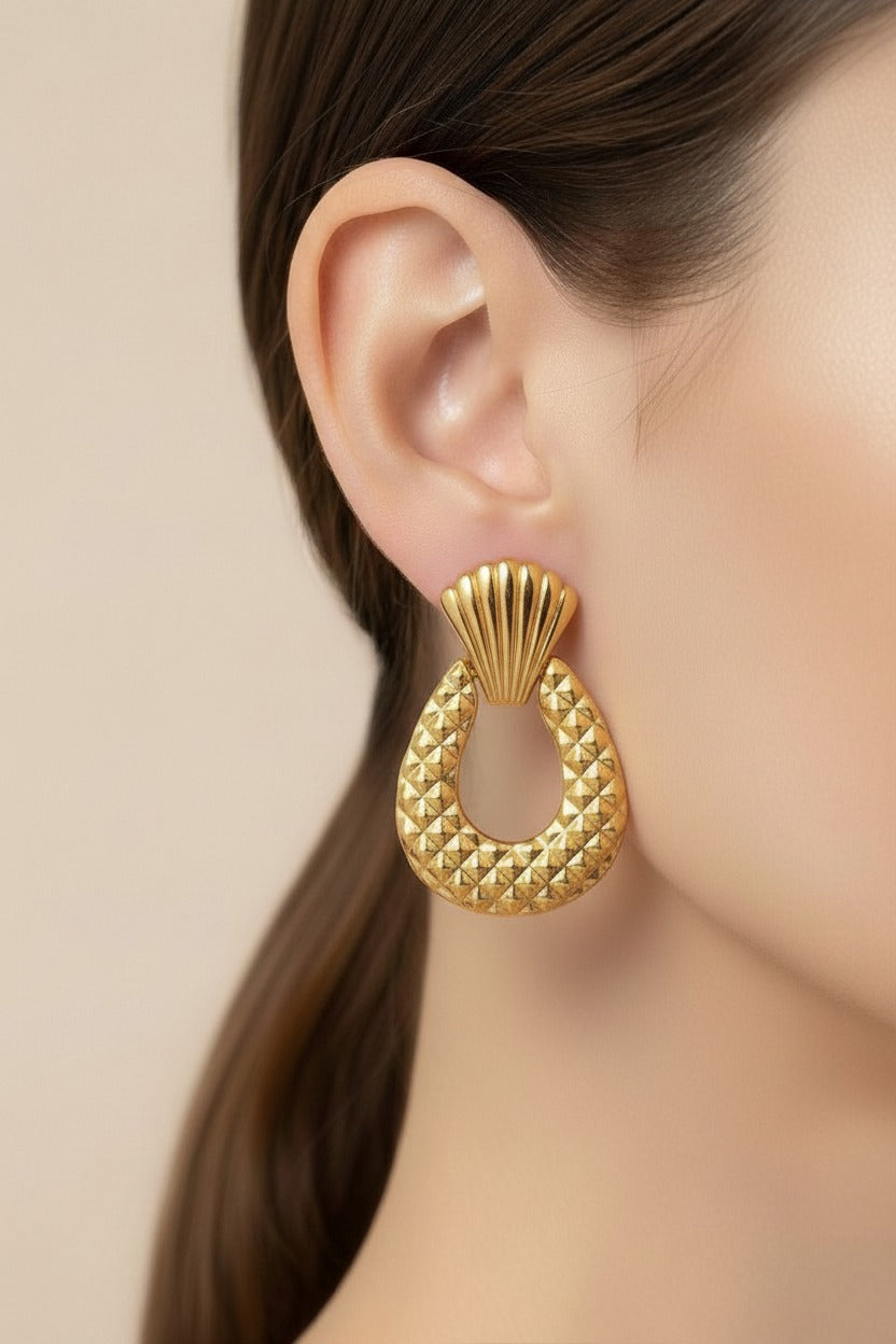 Front view of textured drop statement earrings in 18K PVD gold plated stainless steel with sculpted quilted design