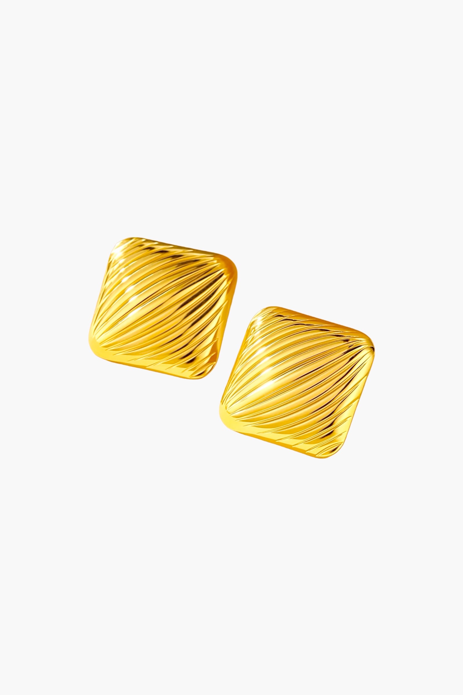 Angled view of textured square stud earrings made from stainless steel with a radiant PVD 18K gold plated finish, featuring diagonal ridged surface and glossy mirror shine – GLISTIA.