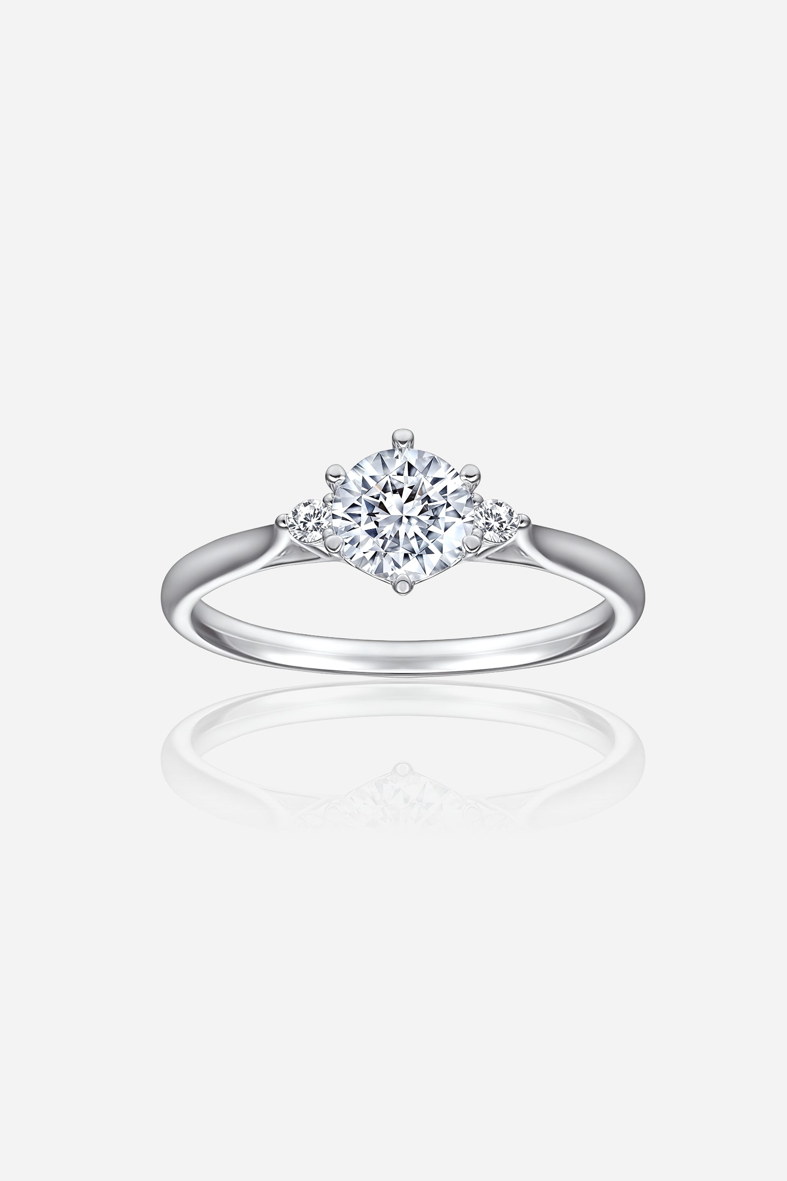 GLISTIA Three-Stone Round-Cut Zircon Ring front view in 925 sterling silver with rhodium coating and 6mm centre stone.