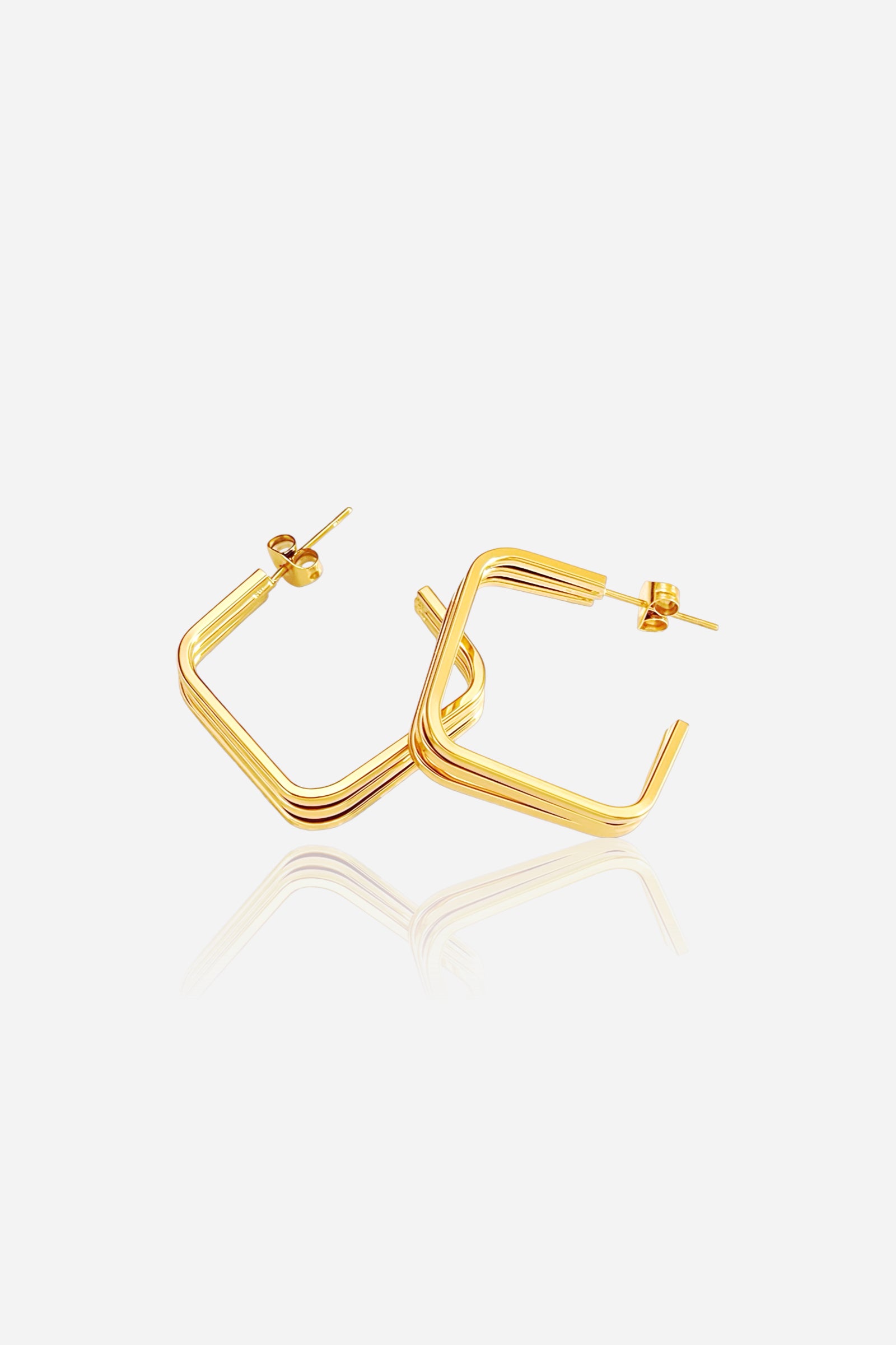Angled view of triple-layer square hoop earrings crafted in stainless steel with a glossy 18K gold plated finish, showcasing layered geometric design – GLISTIA