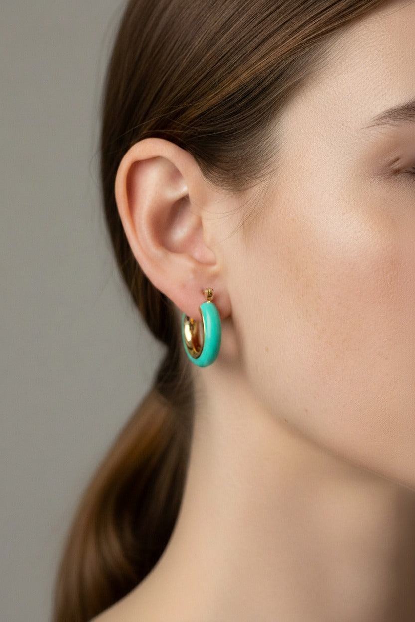 Turquoise enamel hoop earrings in 18K PVD gold plated stainless steel worn on ear, lightweight everyday jewellery by GLISTIA