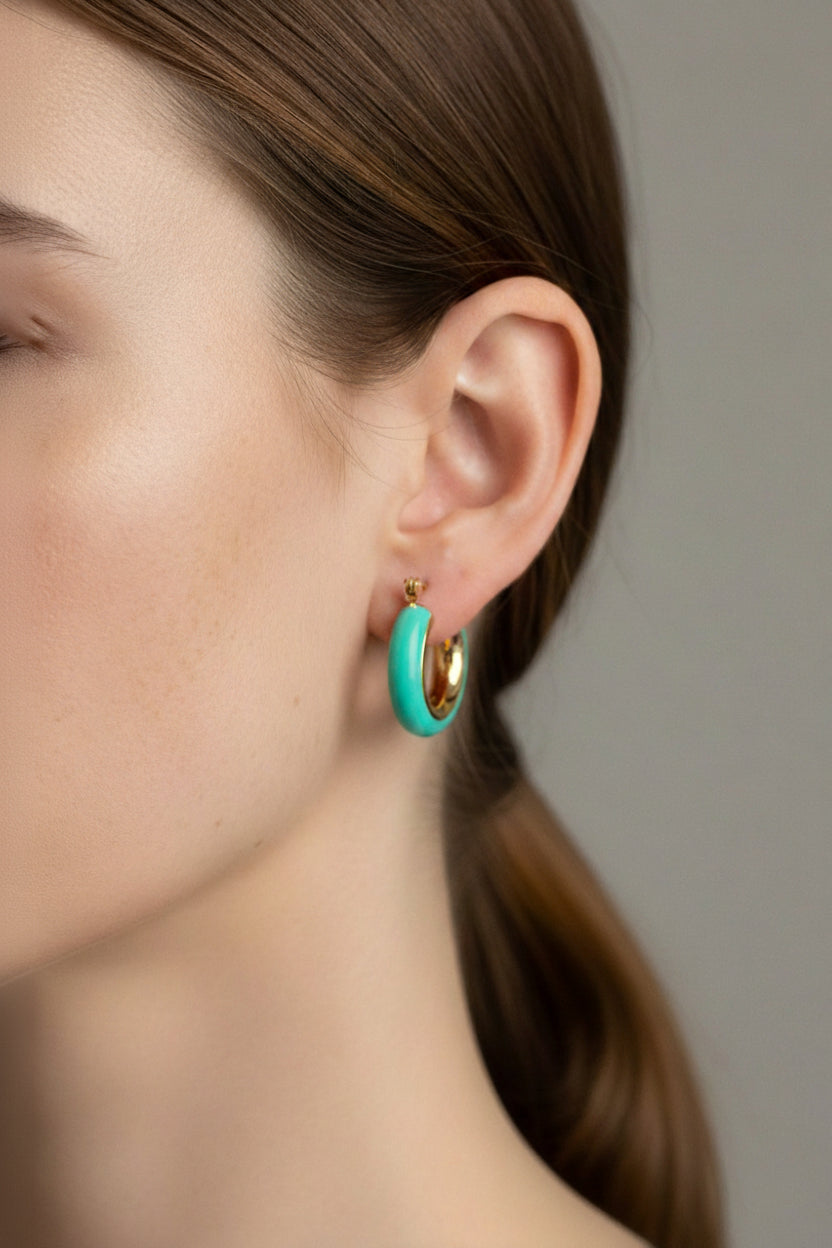 Side view of turquoise enamel hoop earrings in 18K PVD gold plated stainless steel, modern water-safe earrings by GLISTIA