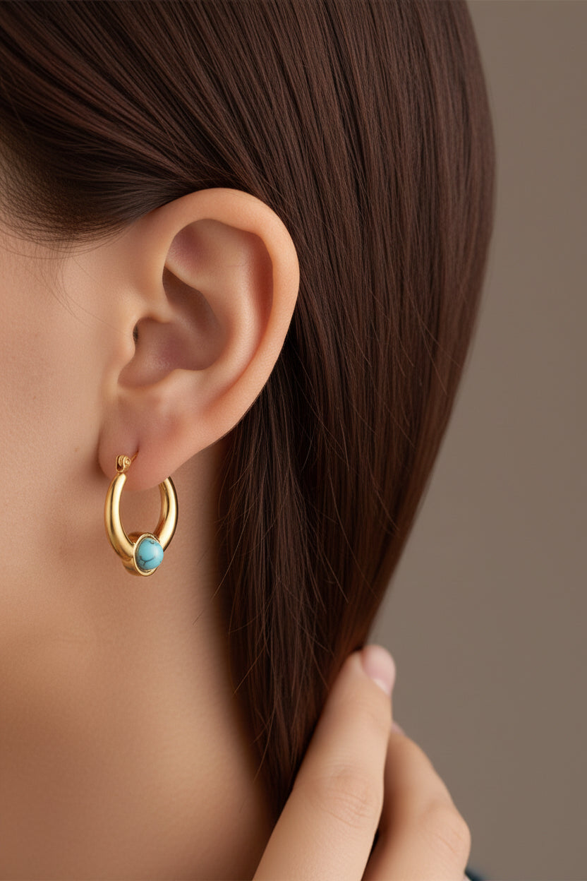 Side view of turquoise stone hoop earrings in 18K PVD gold plated stainless steel with polished gold finish and stone accent
