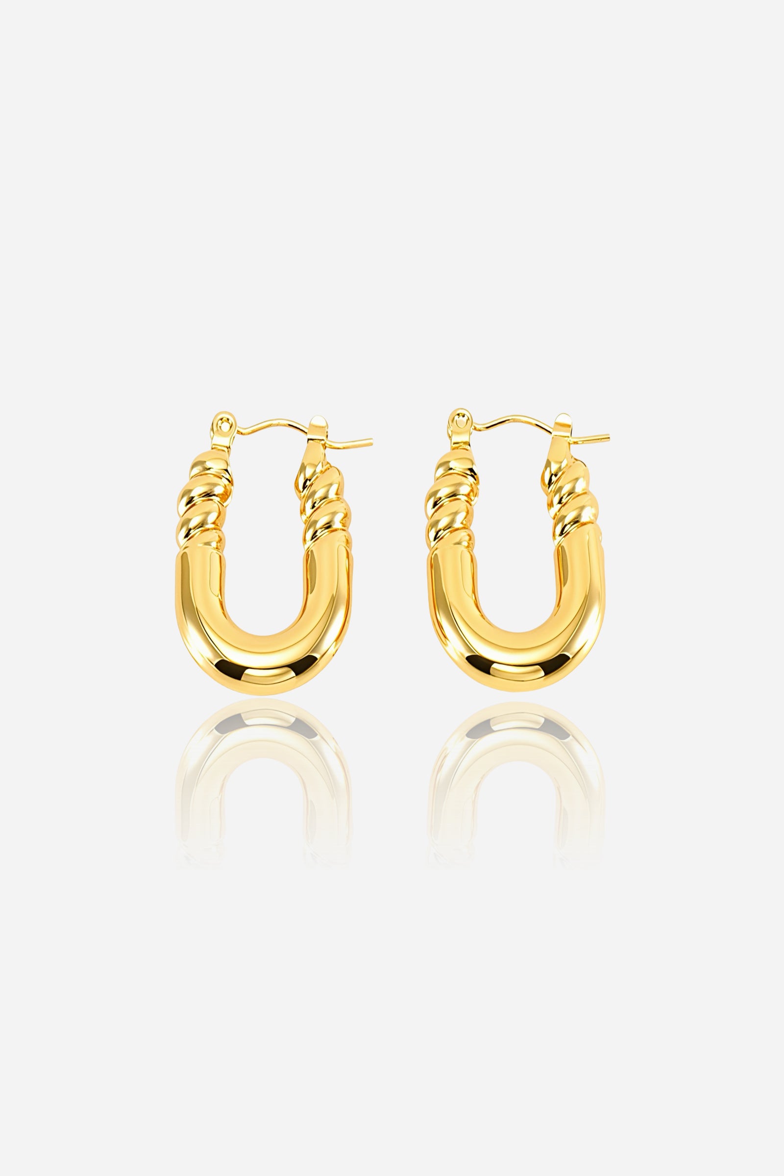 Front view of U-shaped twisted hoop earrings made from stainless steel with a polished PVD 18K gold plated finish, featuring a bold curved base and twisted detailing at the top – GLISTIA.
